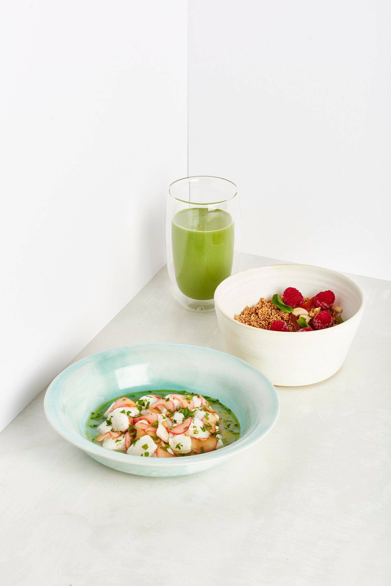 hangover breakfast with sorrel smoothie amaranth bowl and rhubarb ceviche on white background
