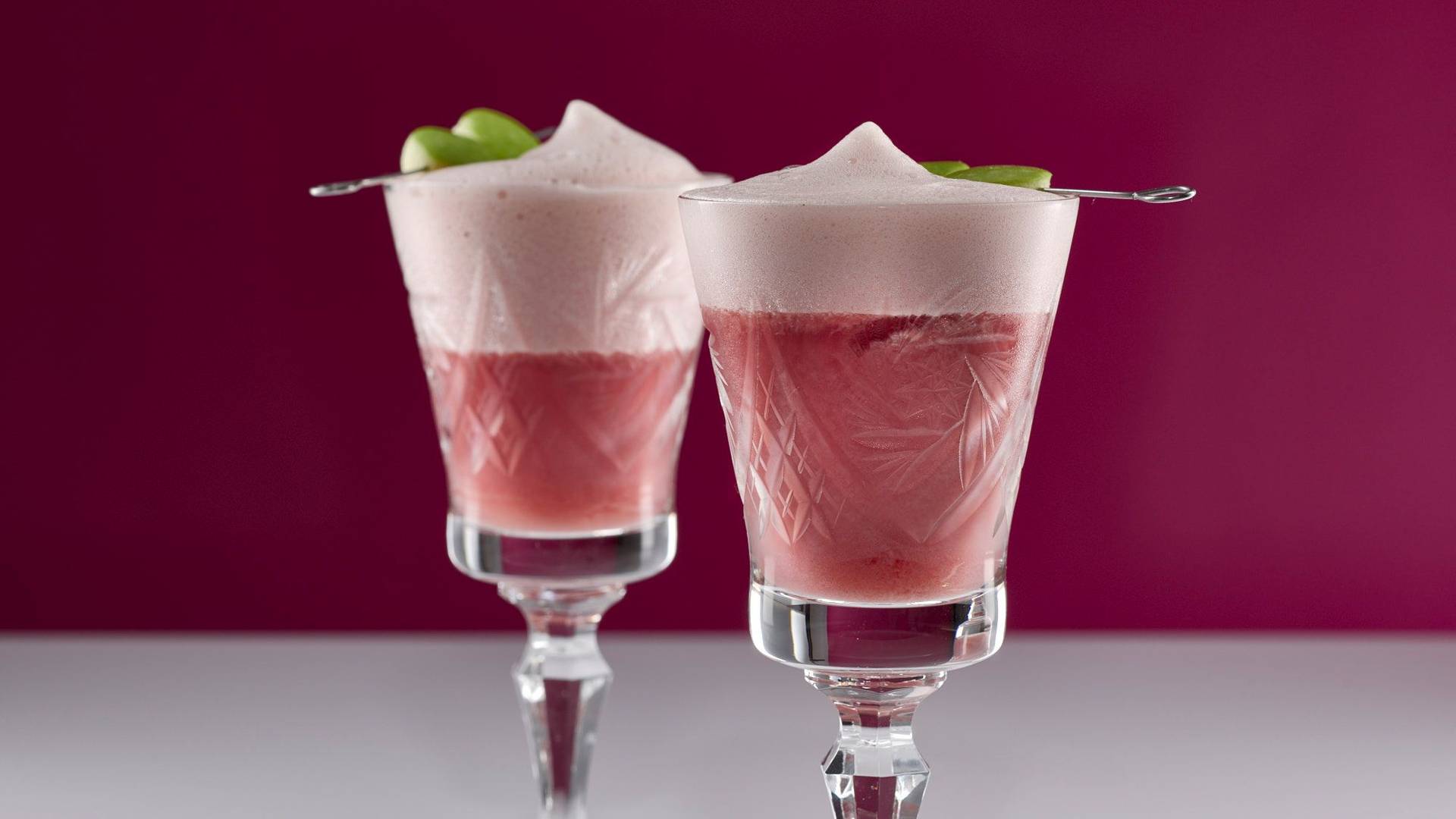 oriental pomegranate mocktail with white and pink background