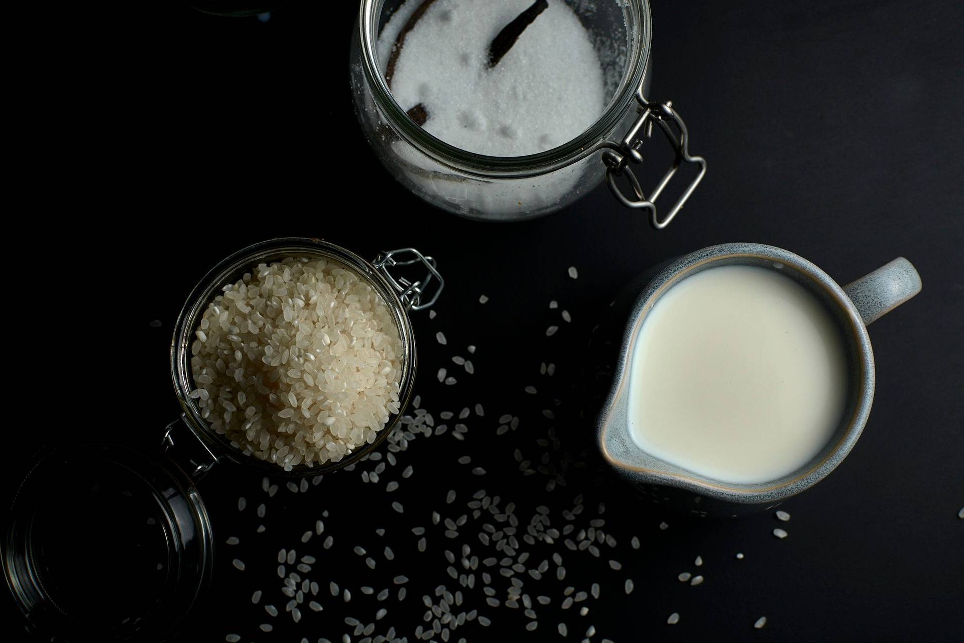 rice pudding ingredients on black background