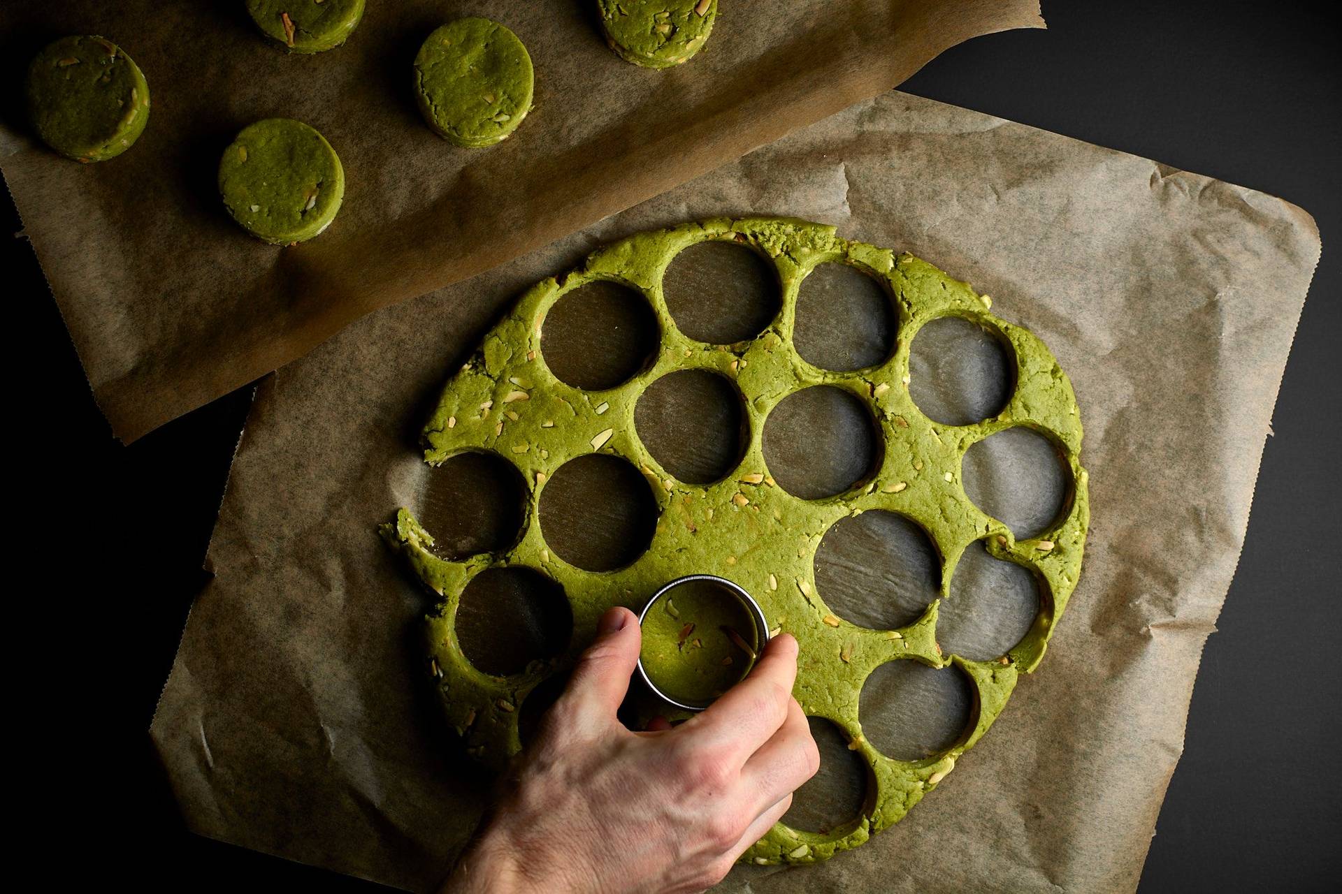making green matcha scones on black background
