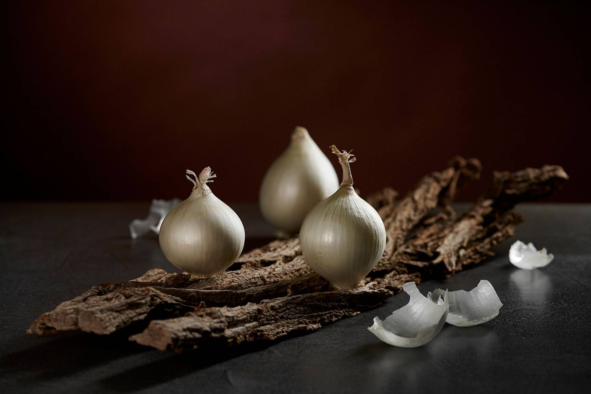 white onions on wood with brown background