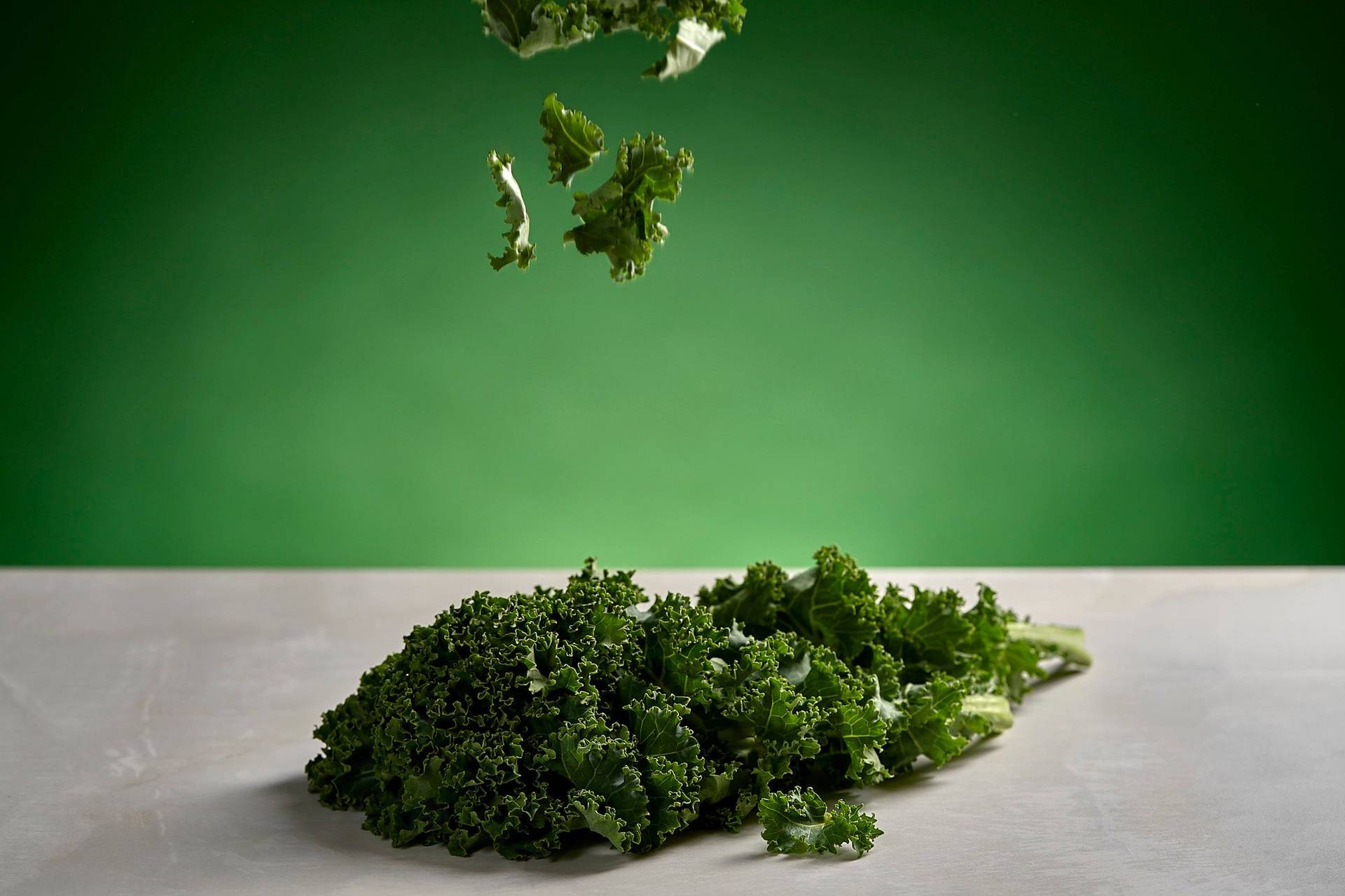 kale on white sapienstone top with green background