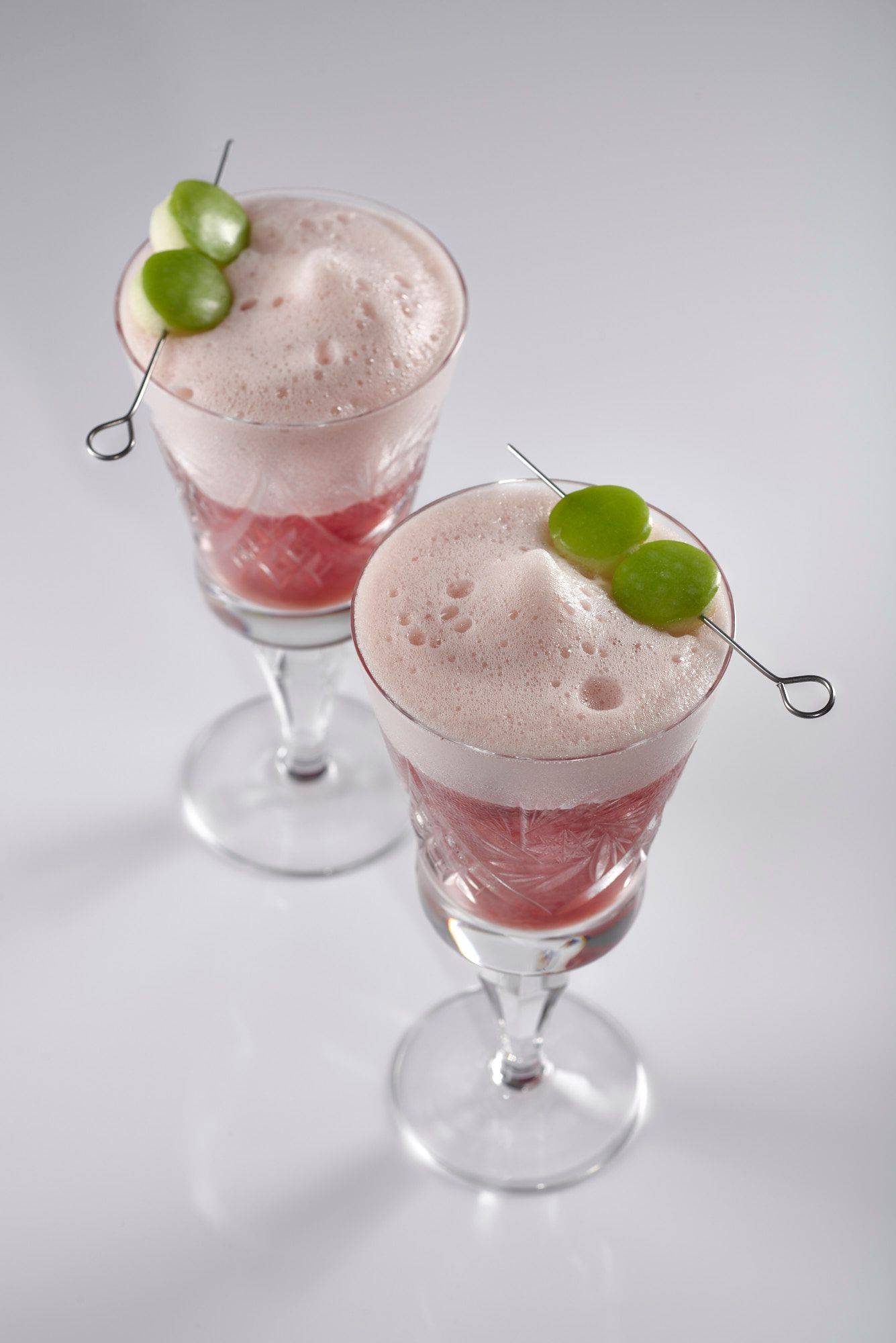 oriental pomegranate mocktail with white background