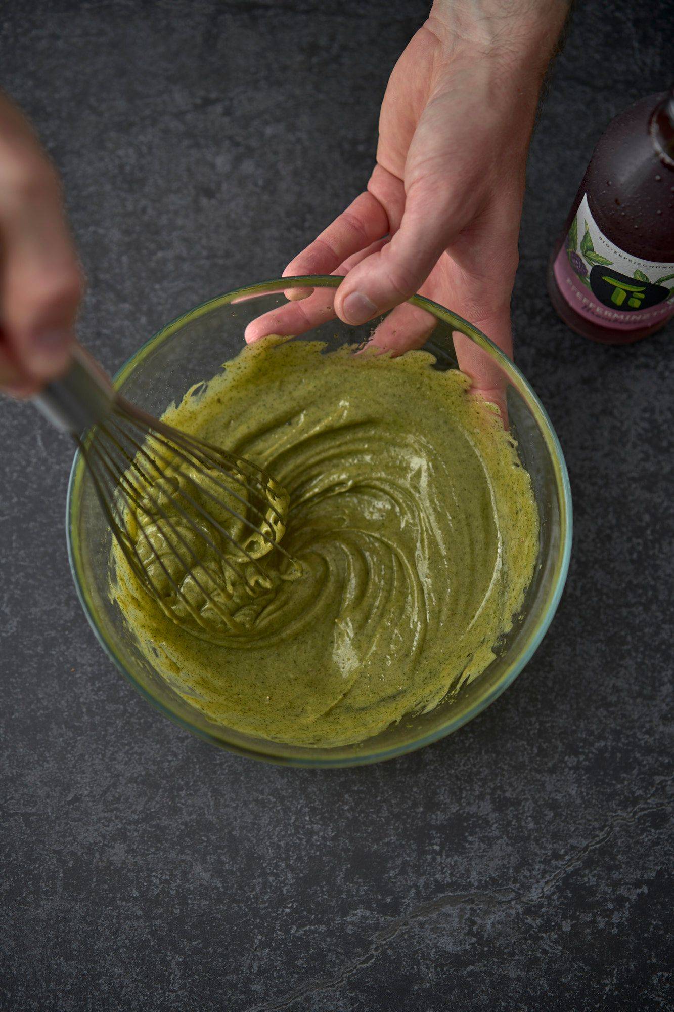 making homemade mint mayonnaise on a gray sapienstone top