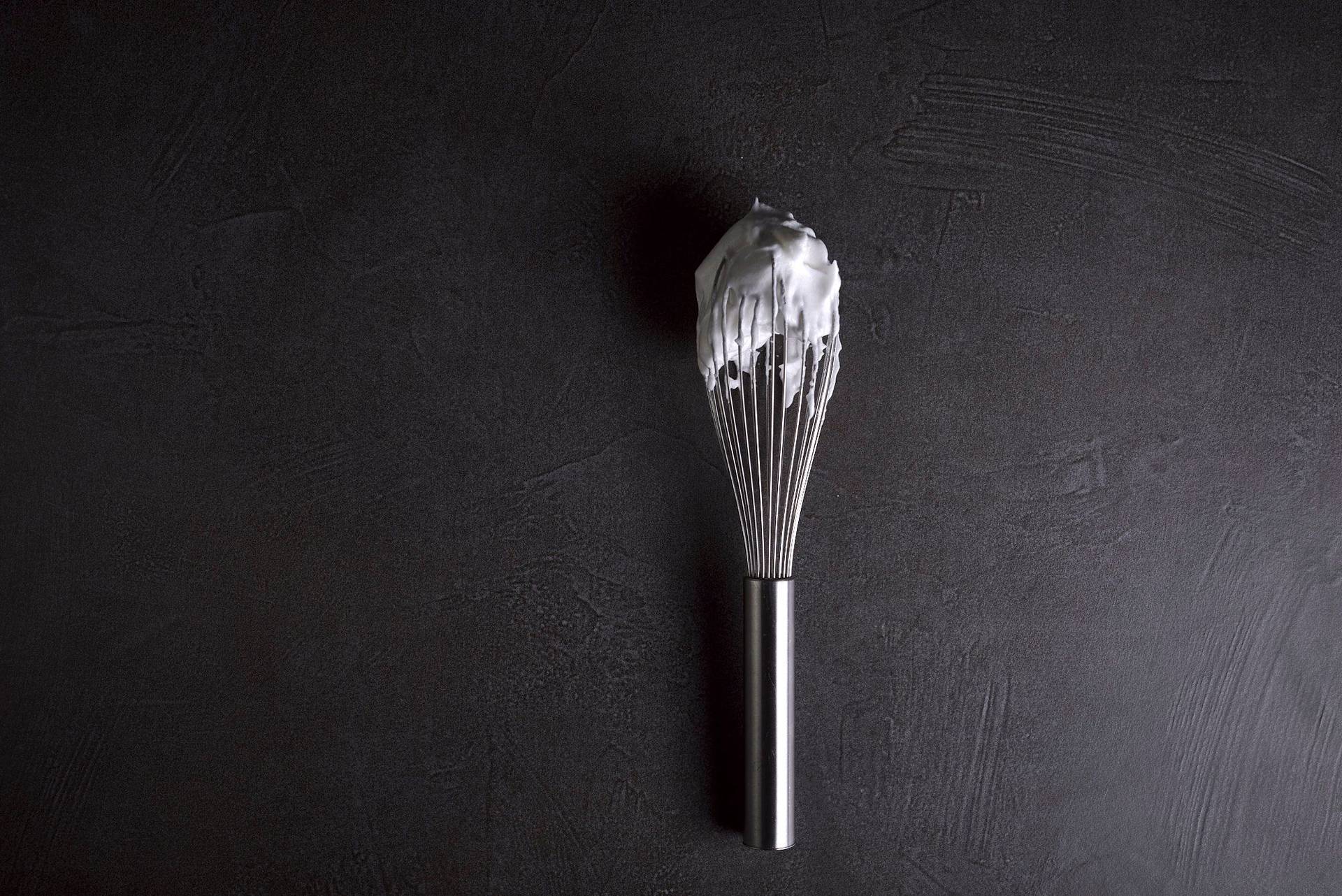 meringue on a whisk with gray sapienstone top