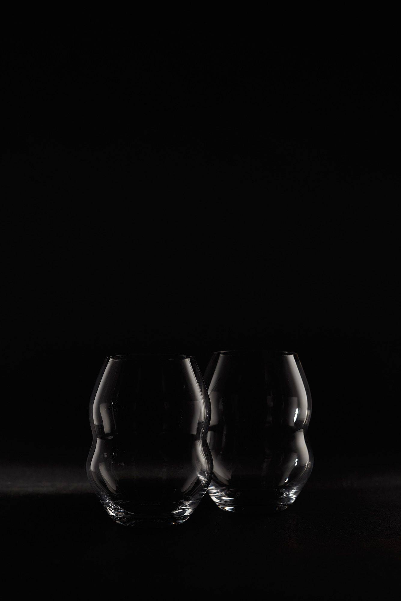 riedel veritas swirl glass on black background