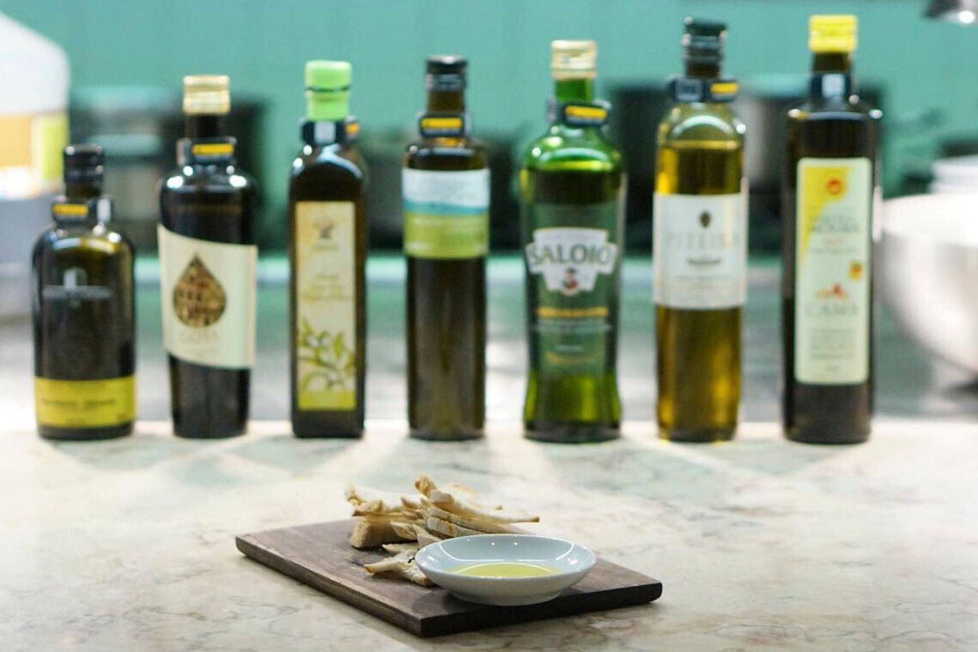 chef leopoldo calhau serving an olive oil dinner in lisbon