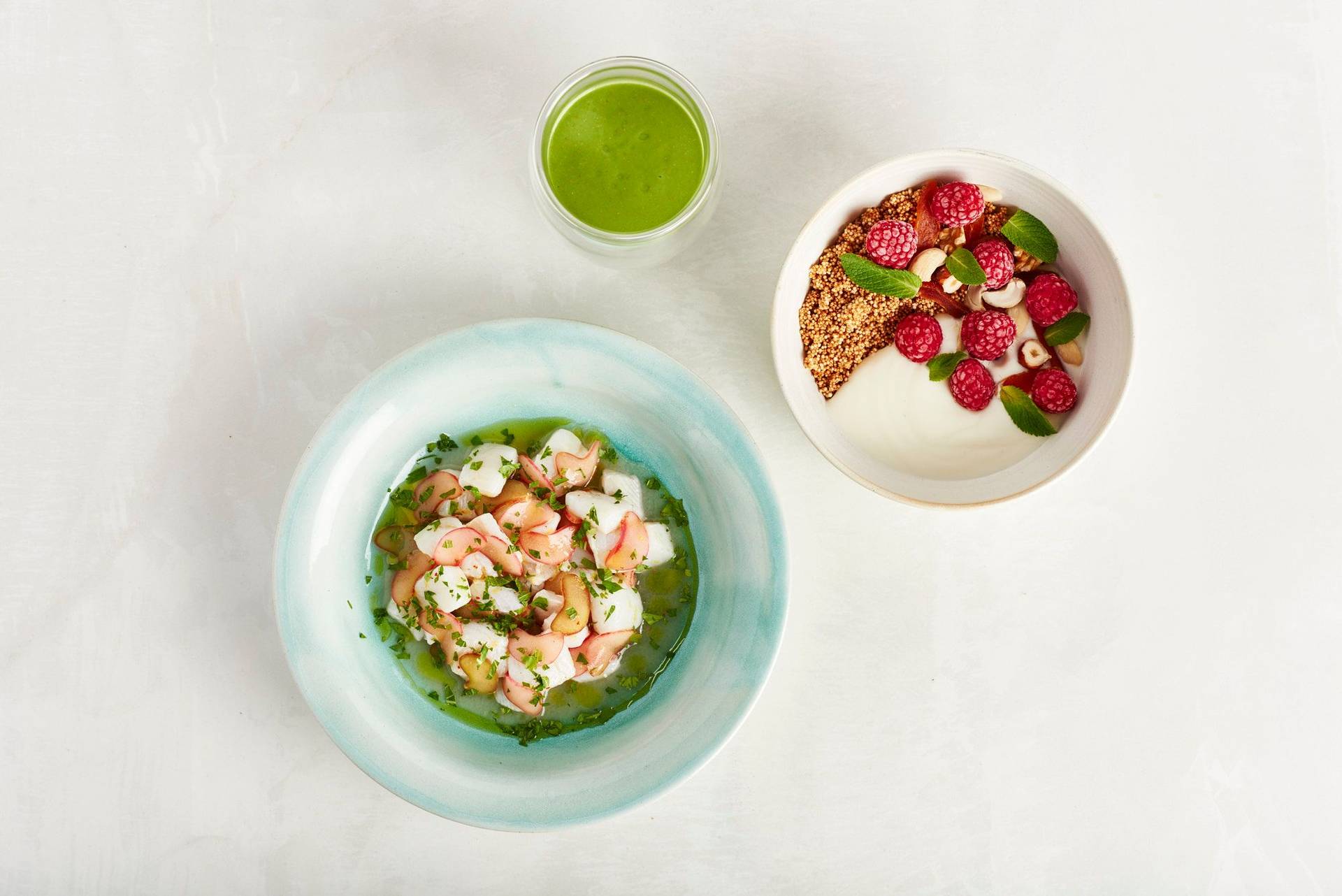 hangover breakfast with sorrel smoothie amaranth bowl and rhubarb ceviche on white background