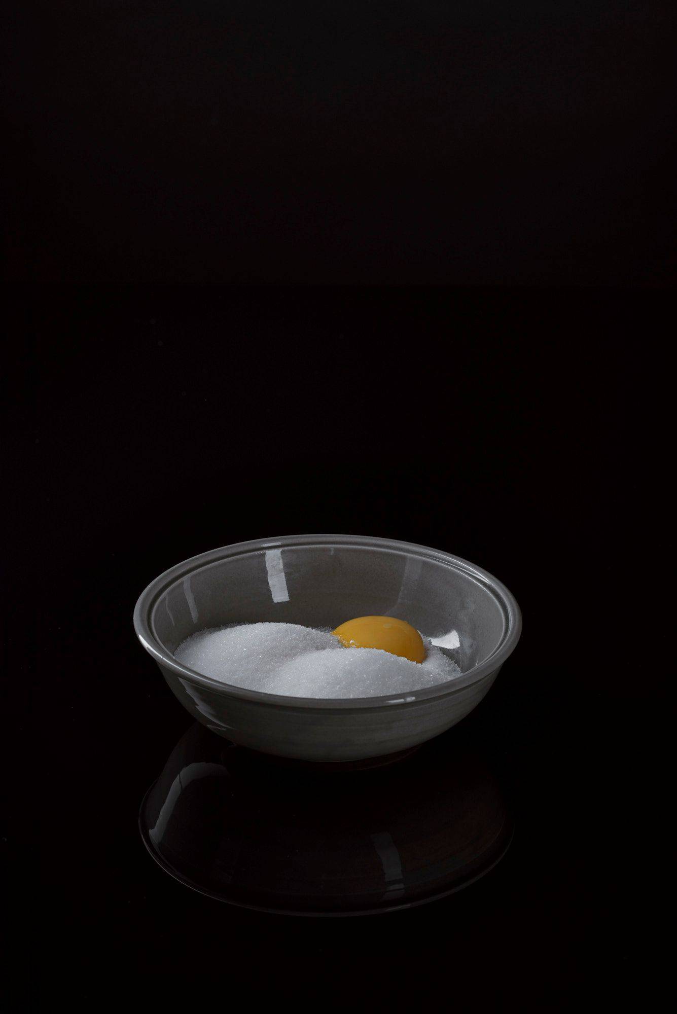curing egg yolks with black background