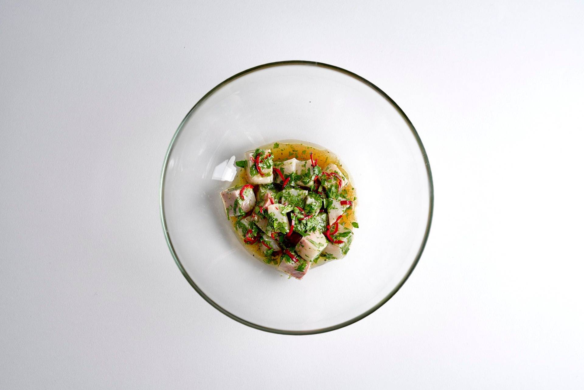 kingfish-ceviche kingfish ceviche in a glass bowl on white background
