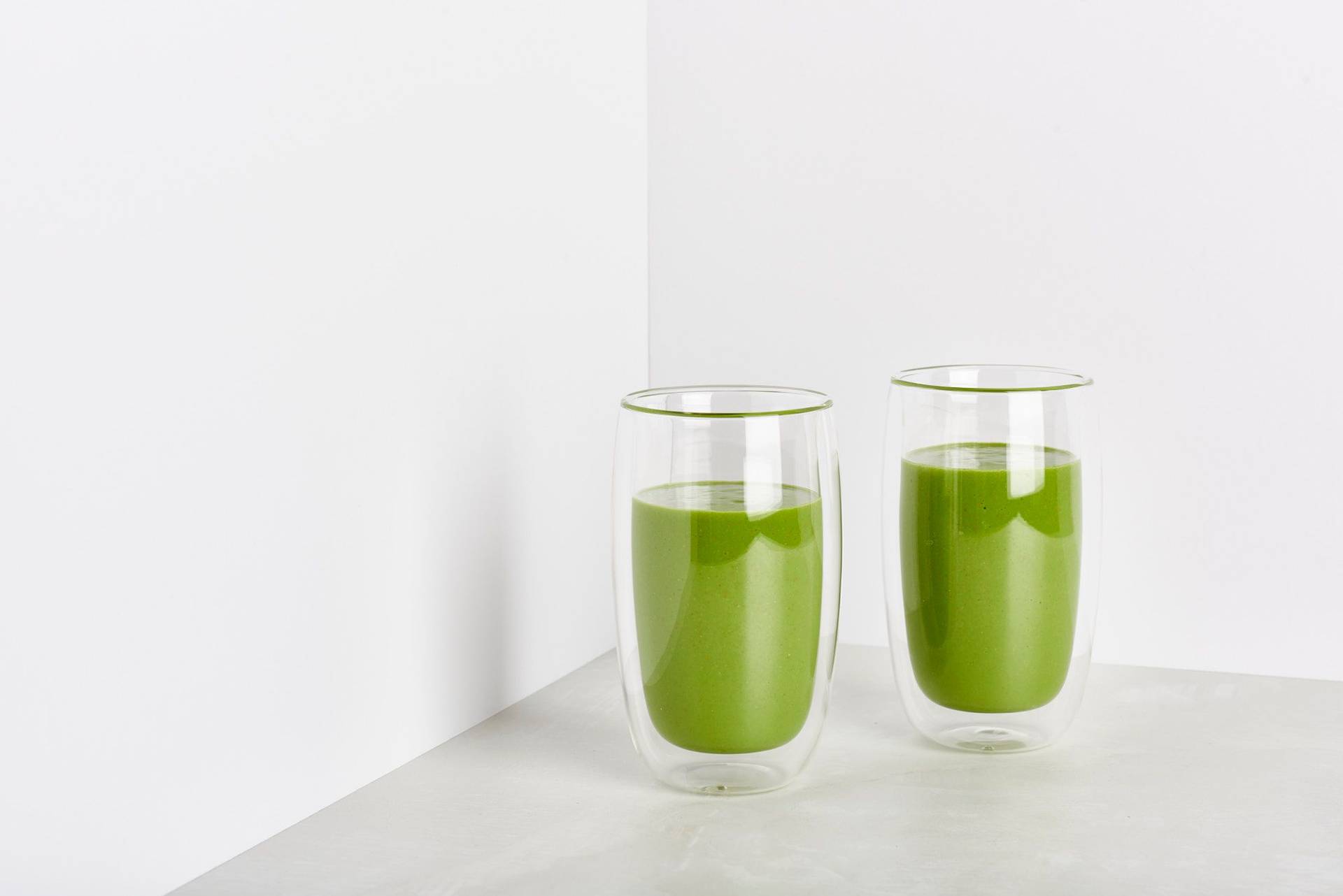 sorrel-and-spelt-smoothie two glasses of sorrel and spelt smoothie on white background