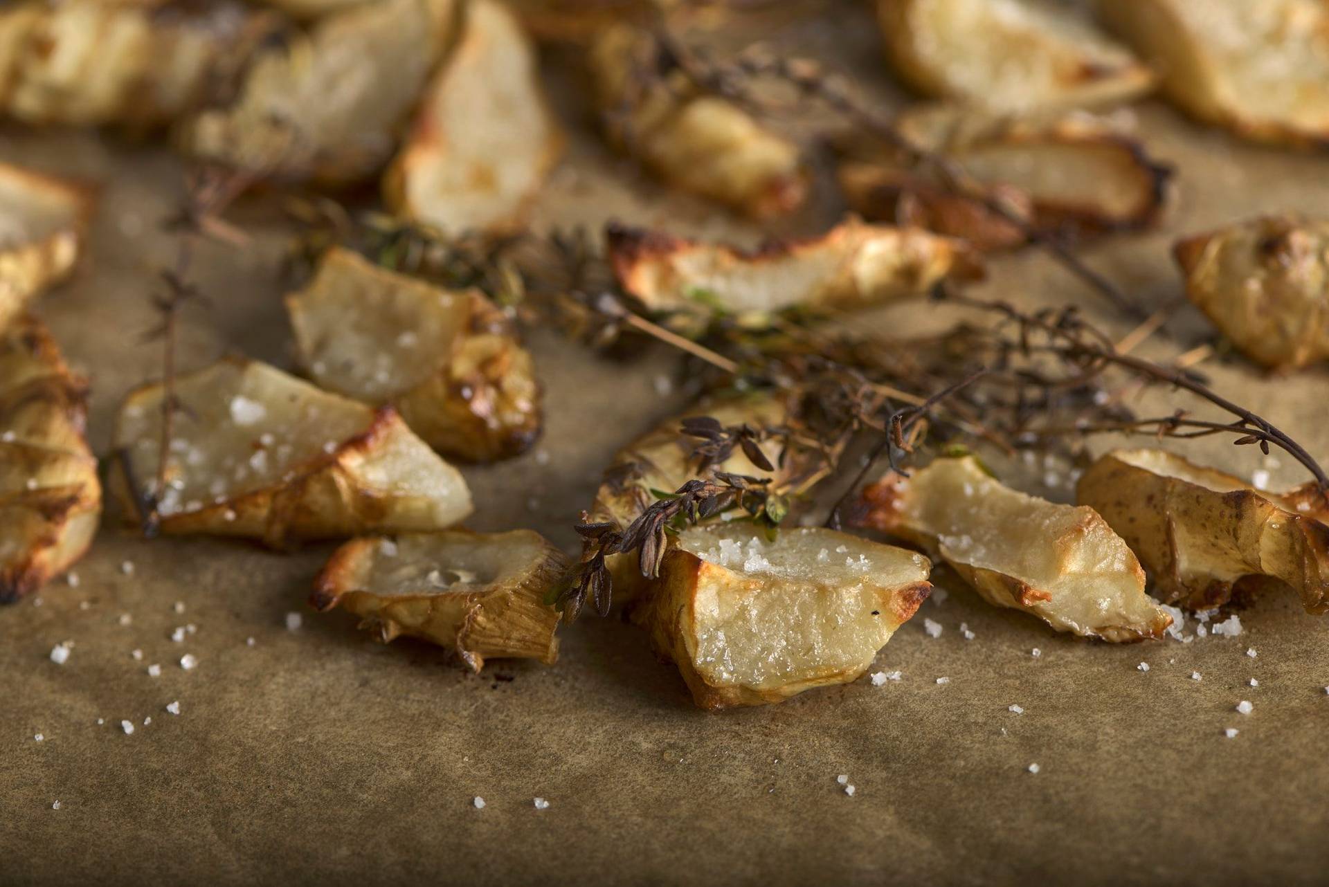 oven roasted jerusalem artichokes on a baking sheet