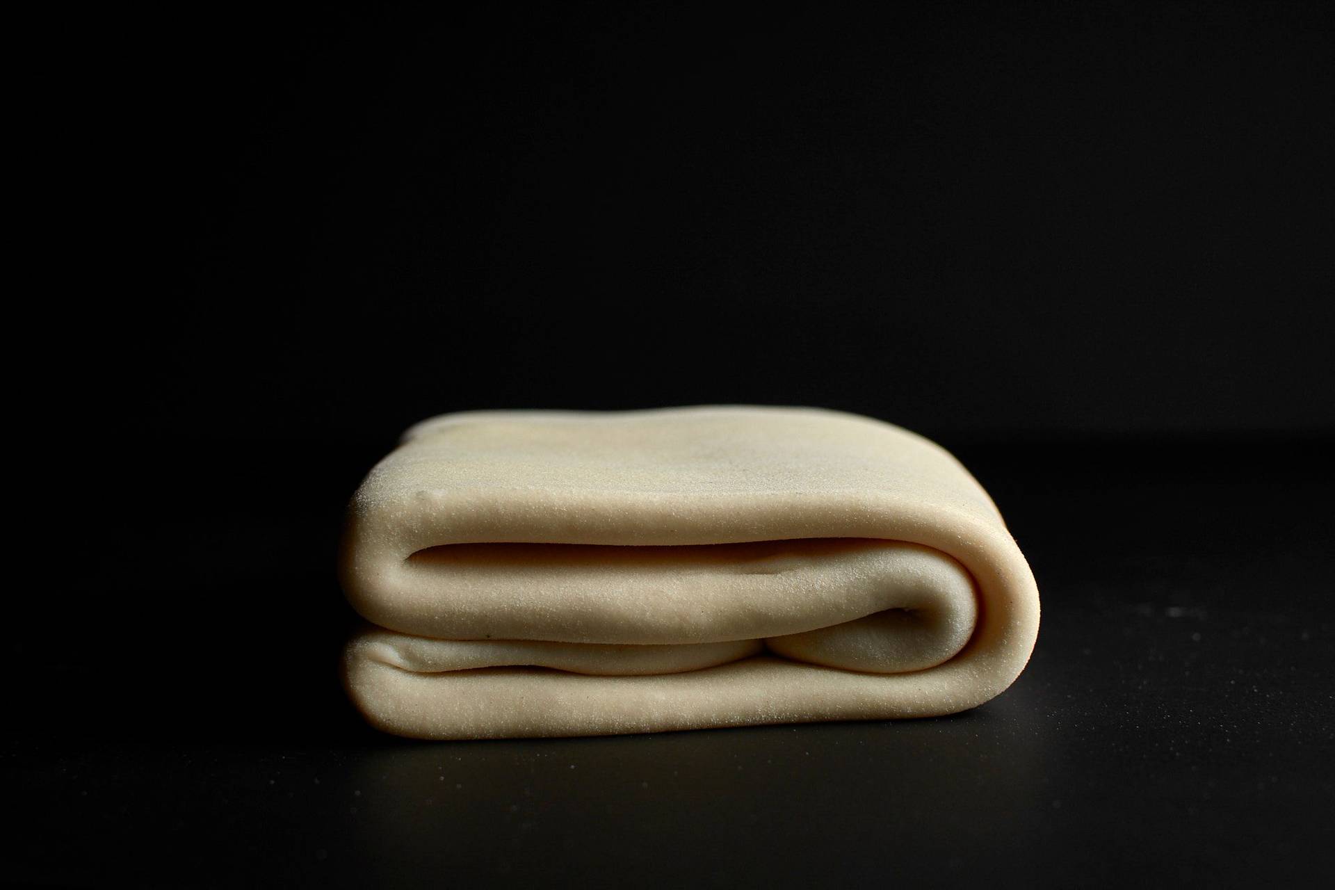 making puff pastry with black background