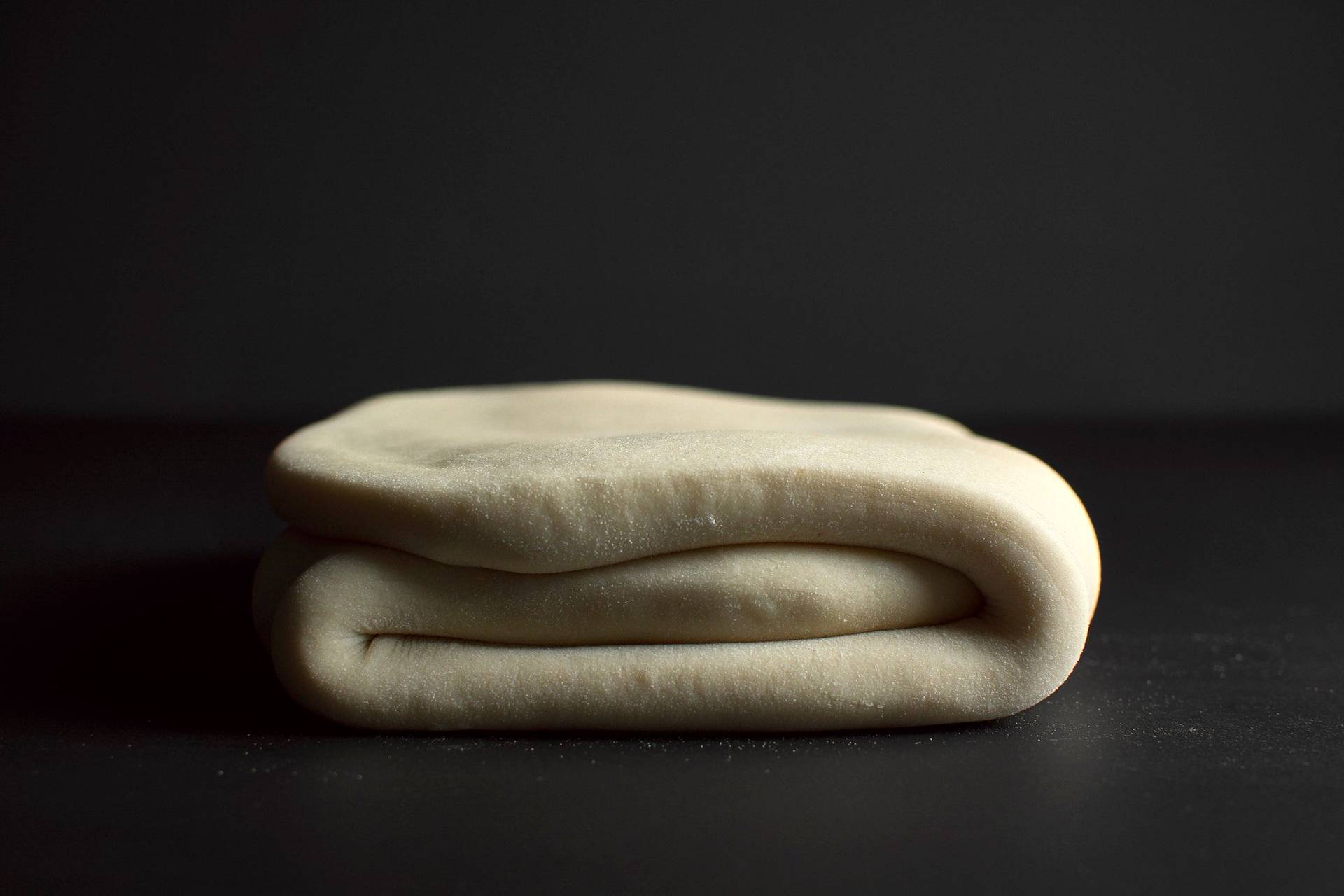 puff-pastry-making making puff pastry with black background