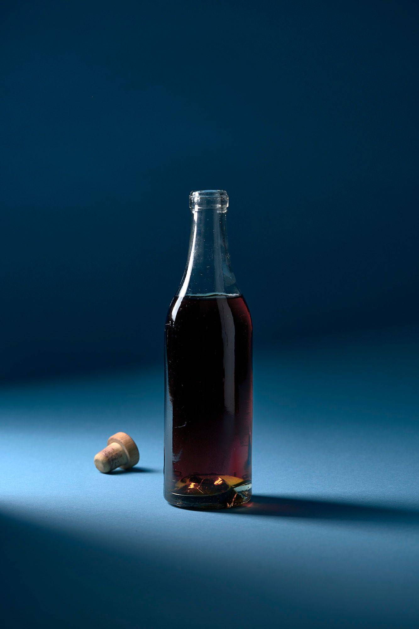 a bottle of italian marsala wine with blue background