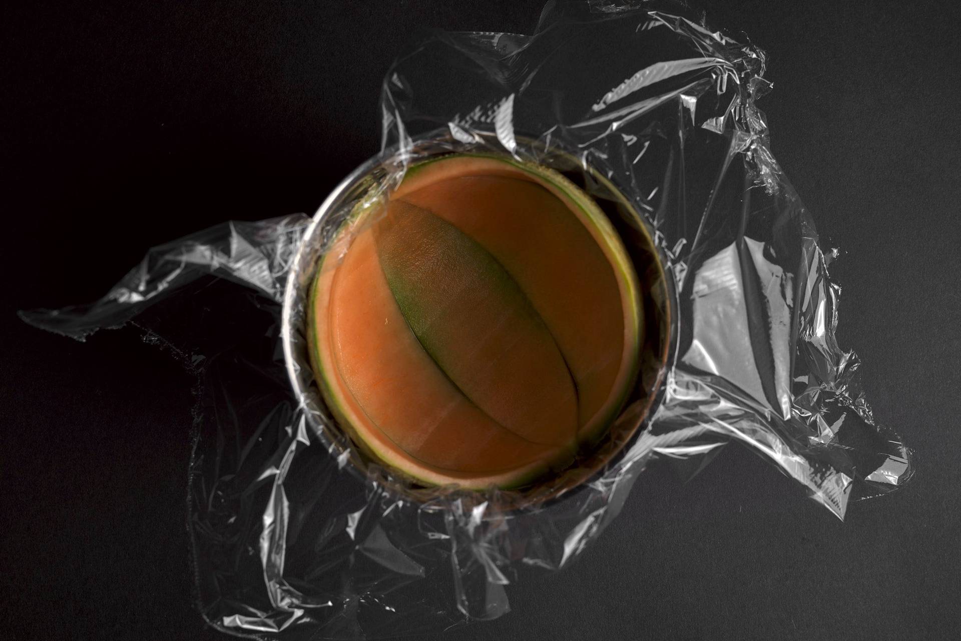 making-cantaloupe-melon-sorbet cantaloupe melon peel in a bowl to fill up with melon sorbet on black background