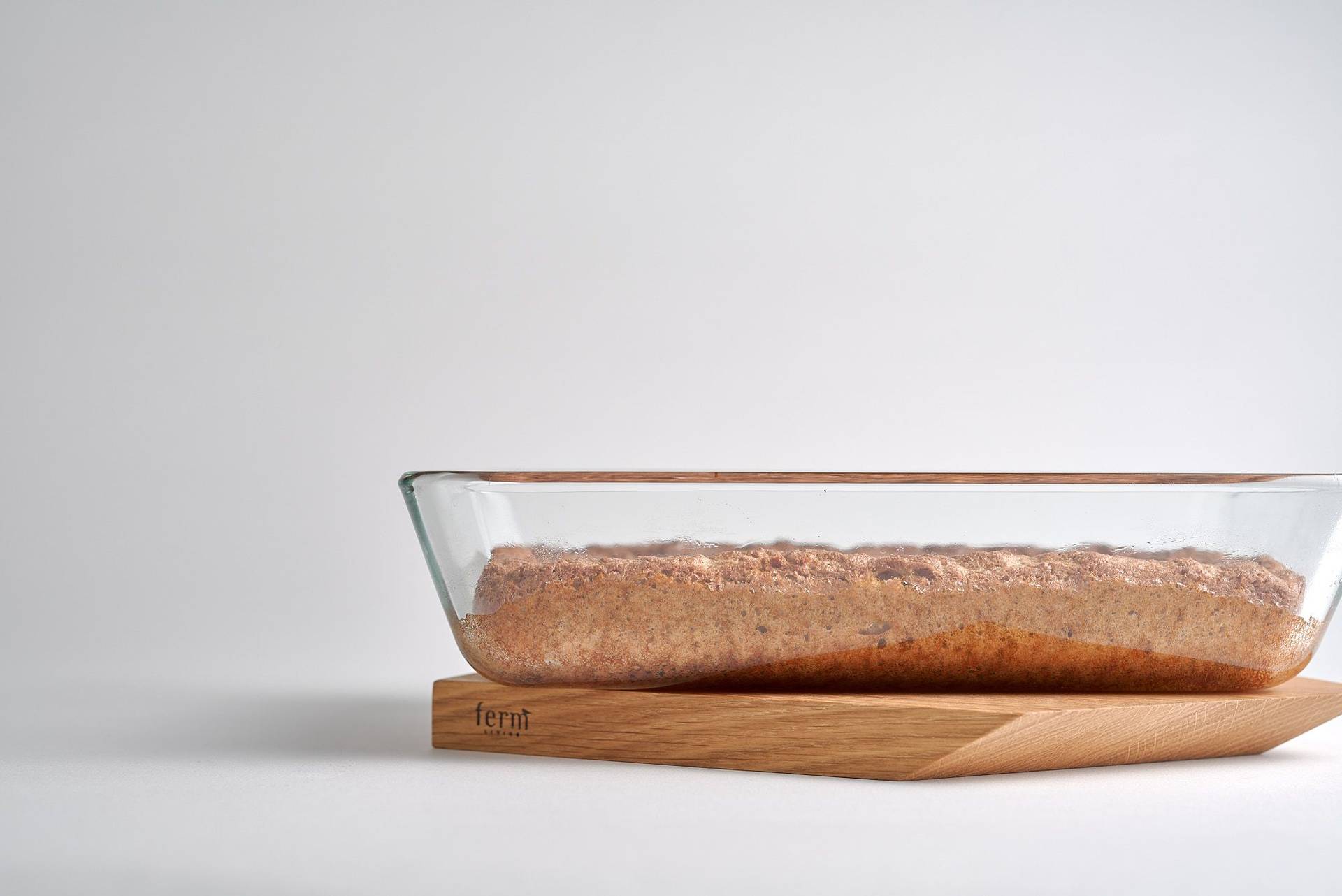 coconut sponge cake on a wooden board with white background