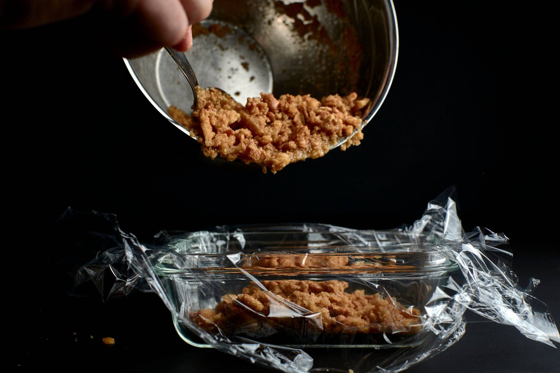 making shortbread snow on black background