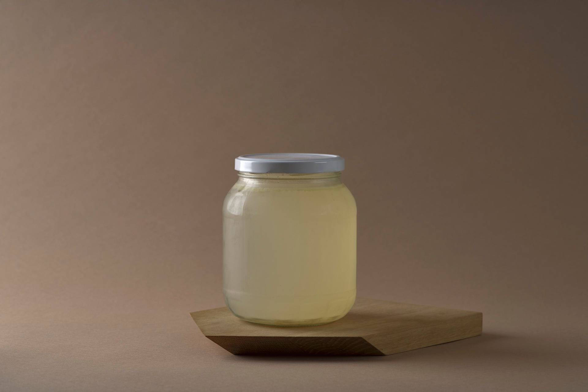asparagus-stock a jar with asparagus stock with brown background