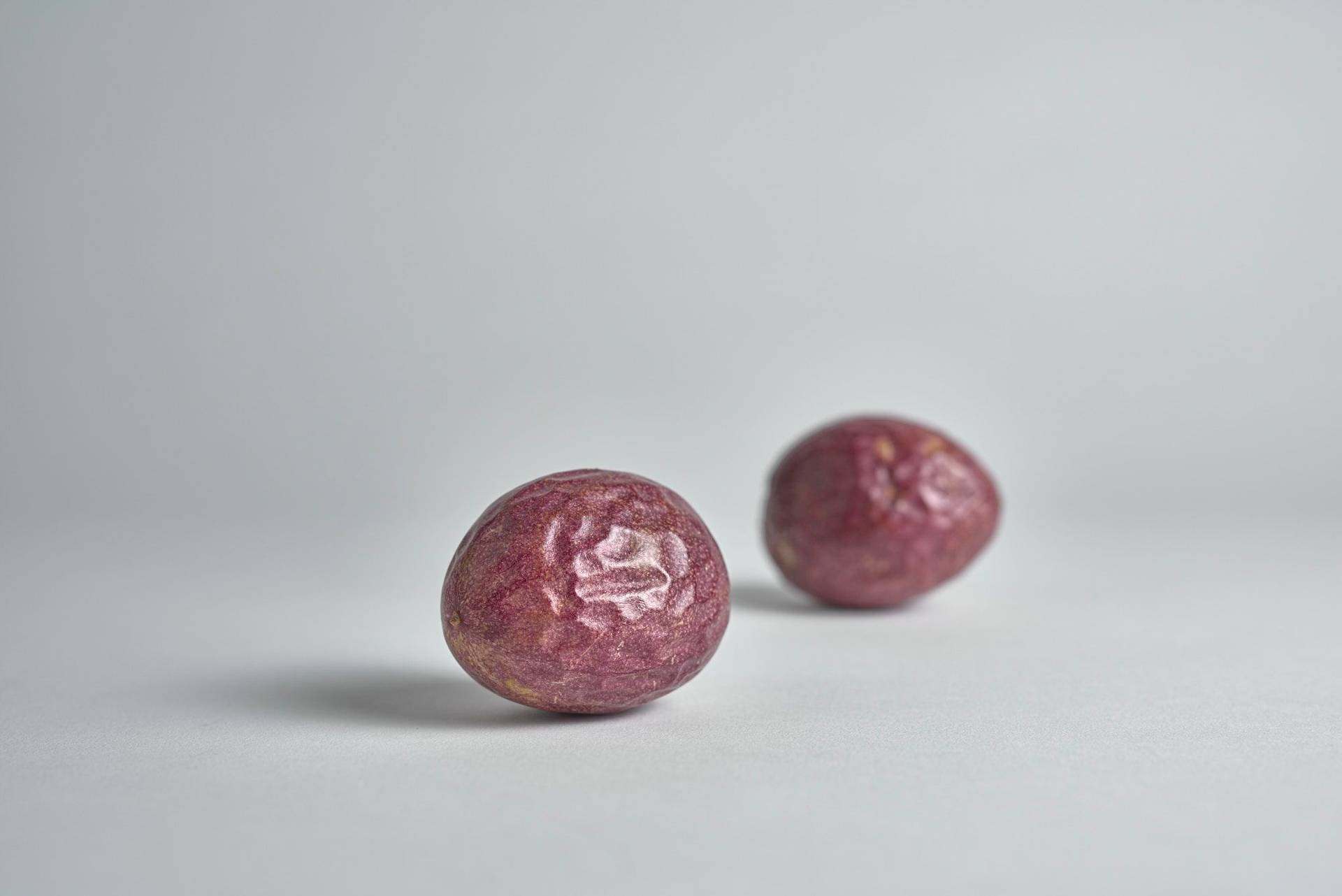 two passion fruits with white background