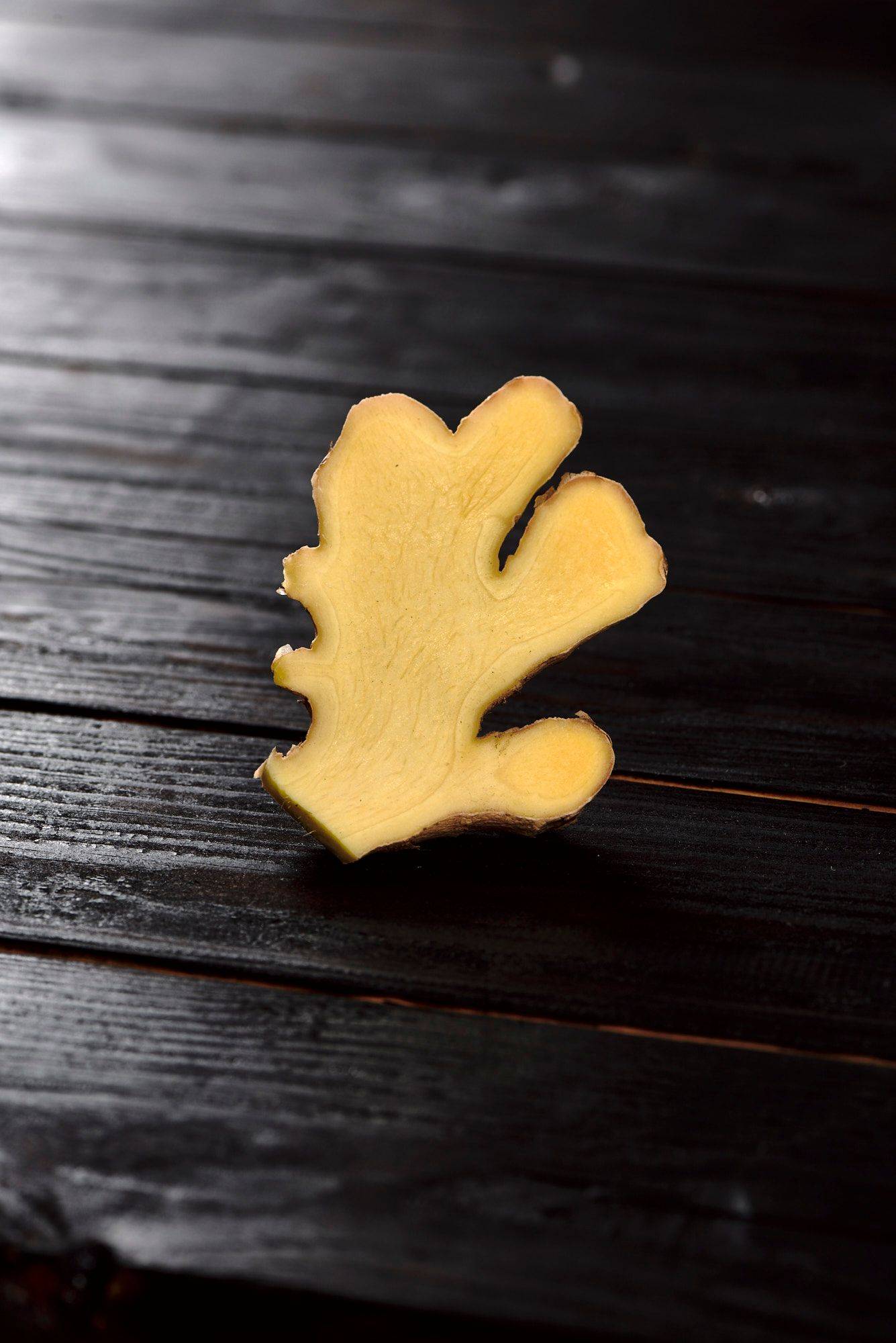 ginger with black wooden background