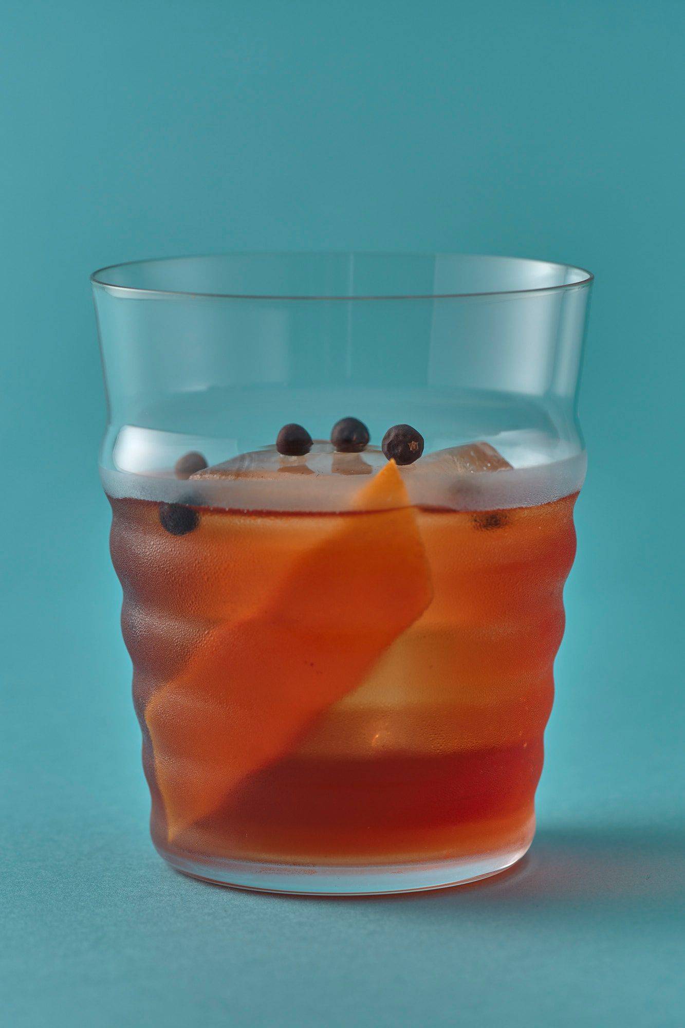 negroni aperitif with the london number one gin on blue background