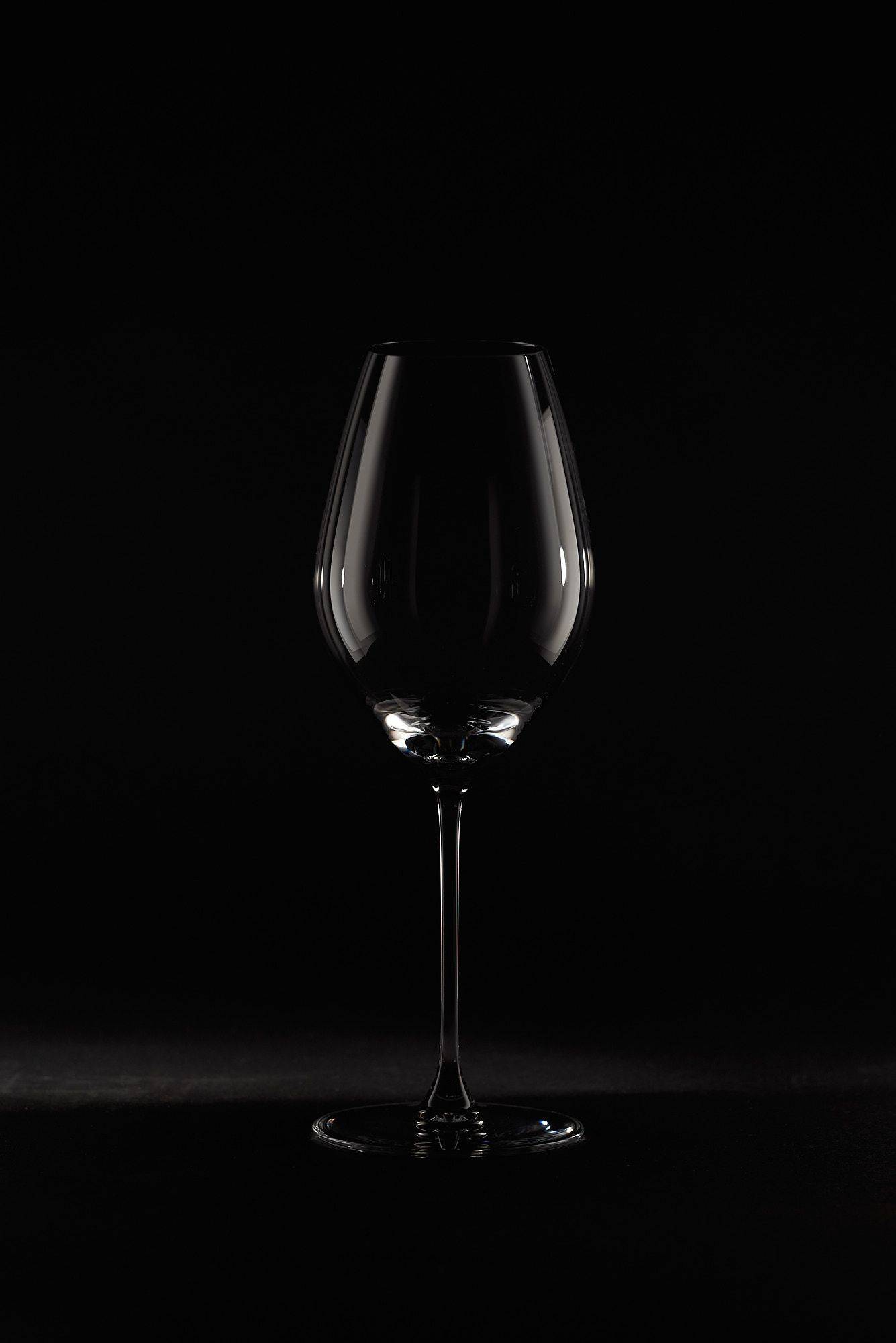 riedel veritas champagne wine glass on black background