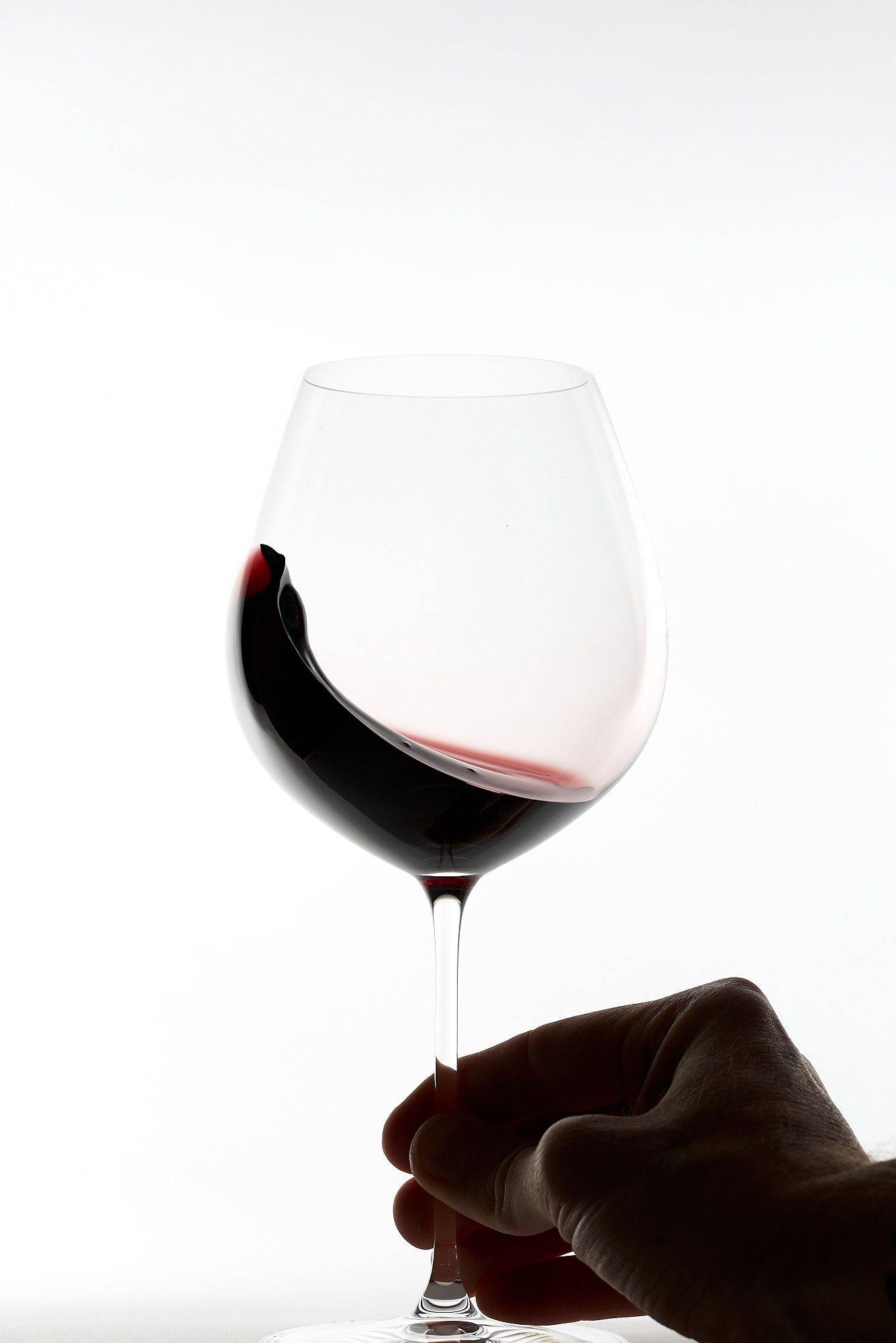 riedel veritas old world pinot noir wine glass on white background