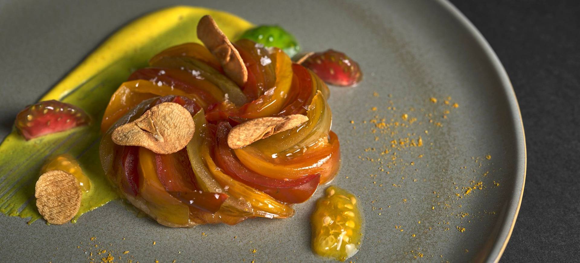 Tomato Tarte Tatin with Curry Crème Fraîche & Garlic Crisps 