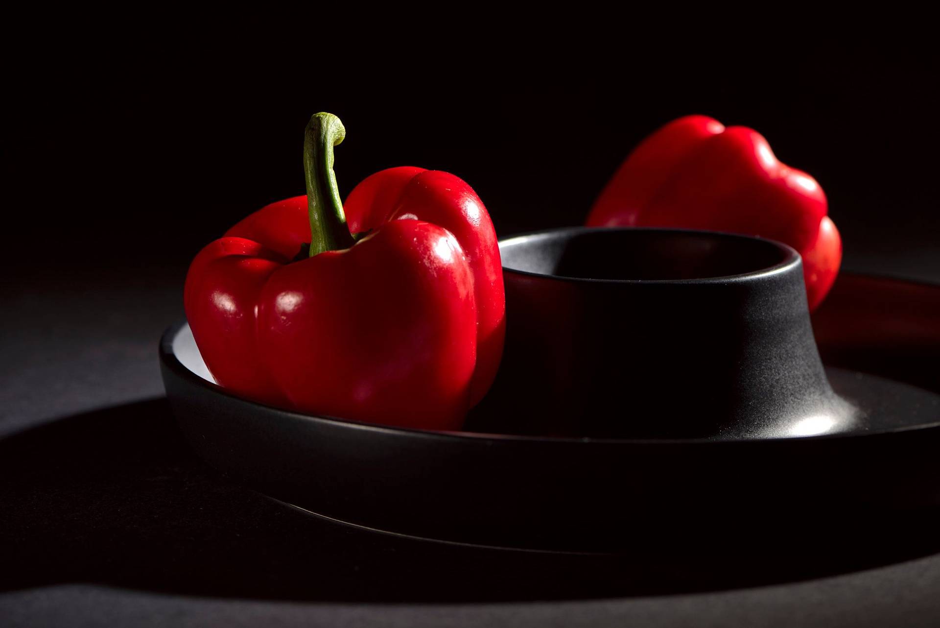 bell-pepper two bell peppers on black background