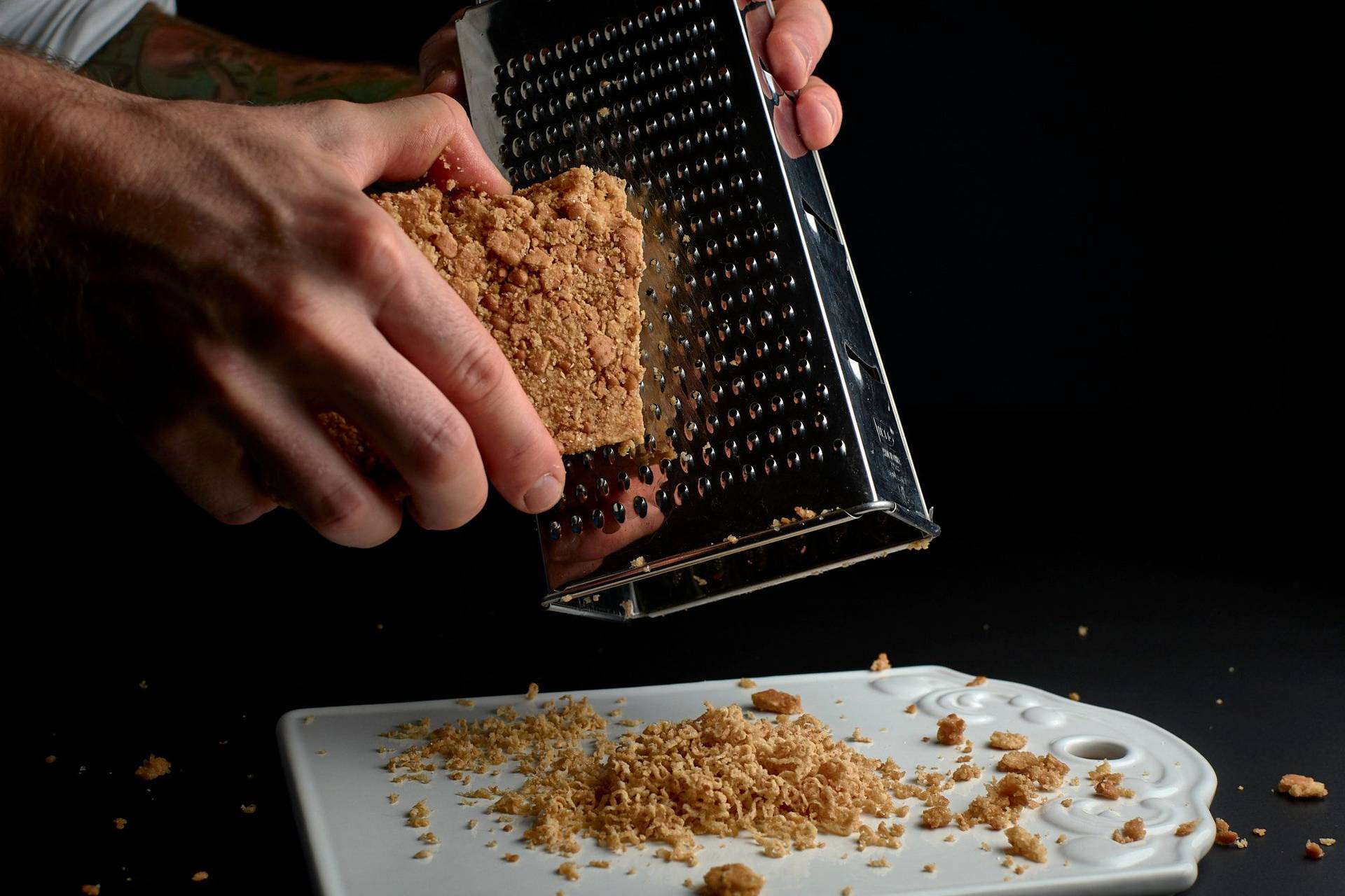 making shortbread snow on black background