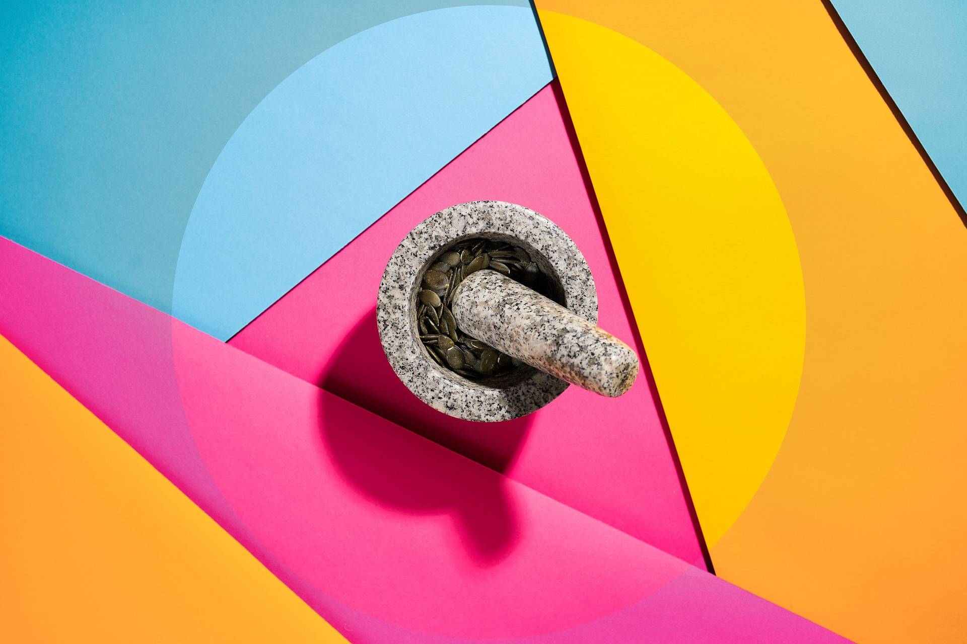 pumpkin-seeds-in-a-mortar pumpkin seeds in a mortar on colorful underground