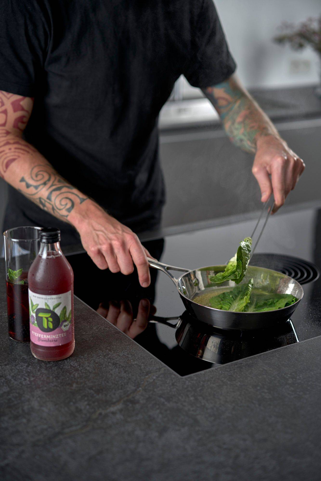 man making sour lettuce hearts in home kitchen