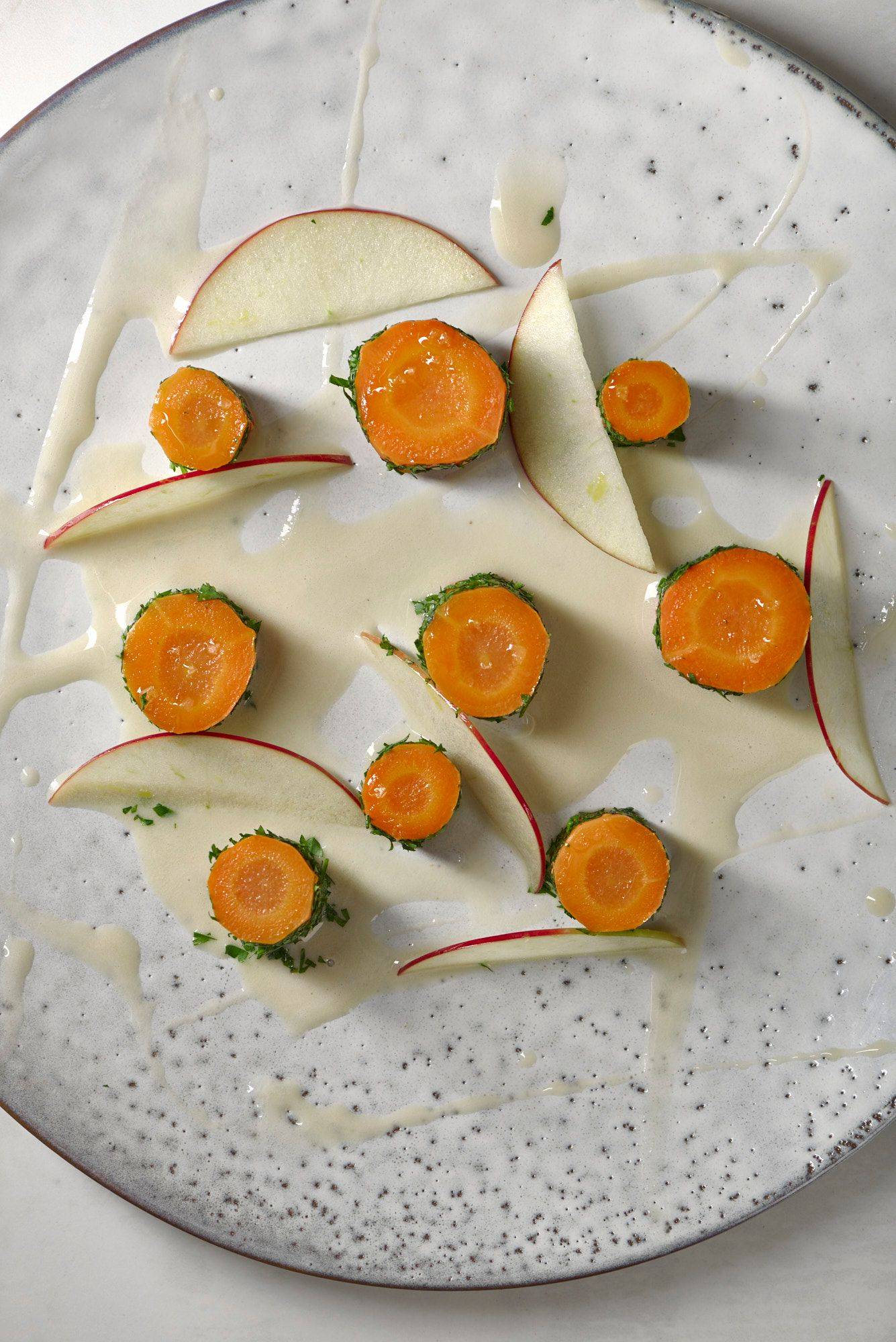 carrot and hay on a white plate with white sapienstone top 