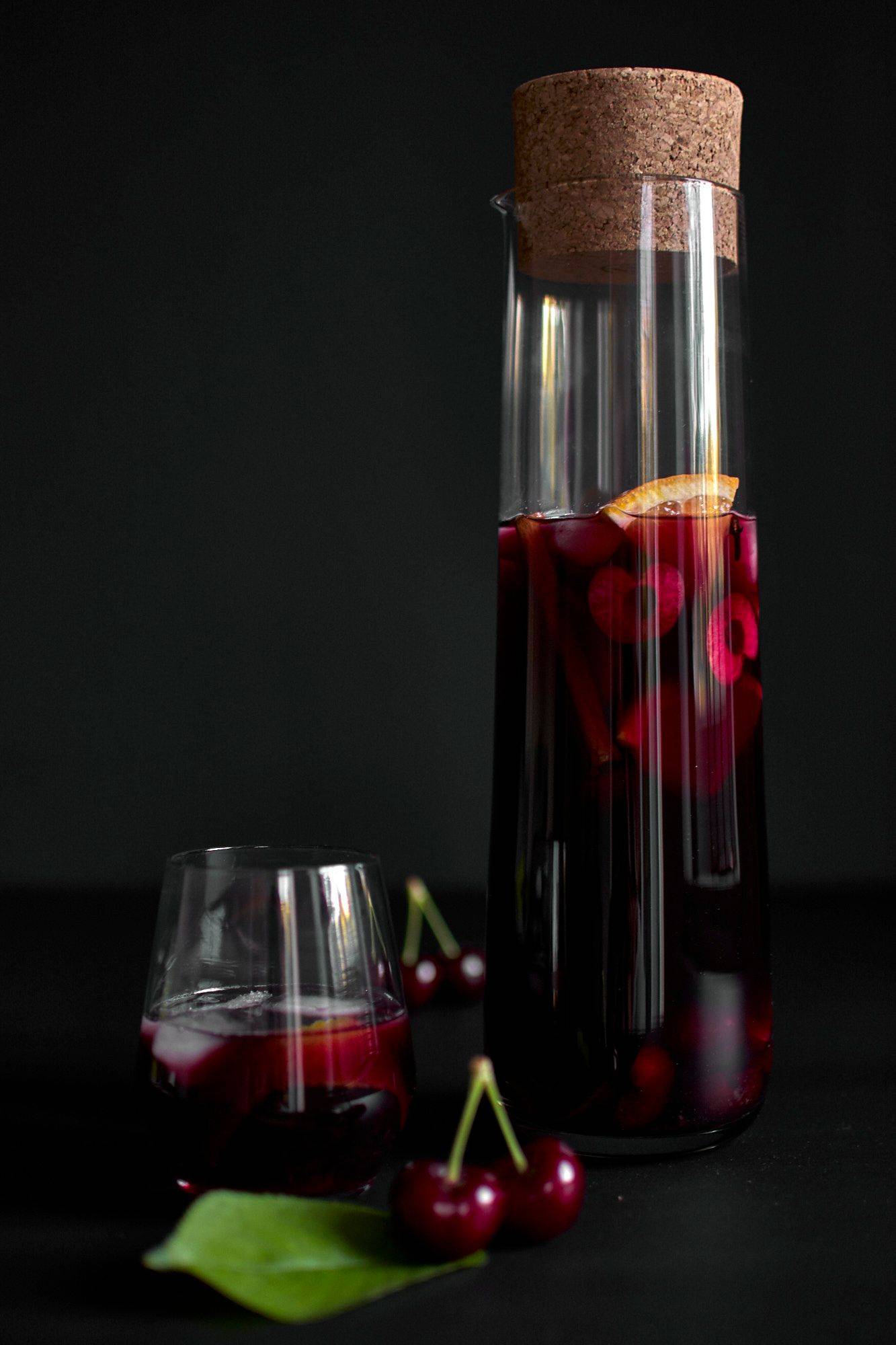 a jug of portuguese-ginja-sangria on black background