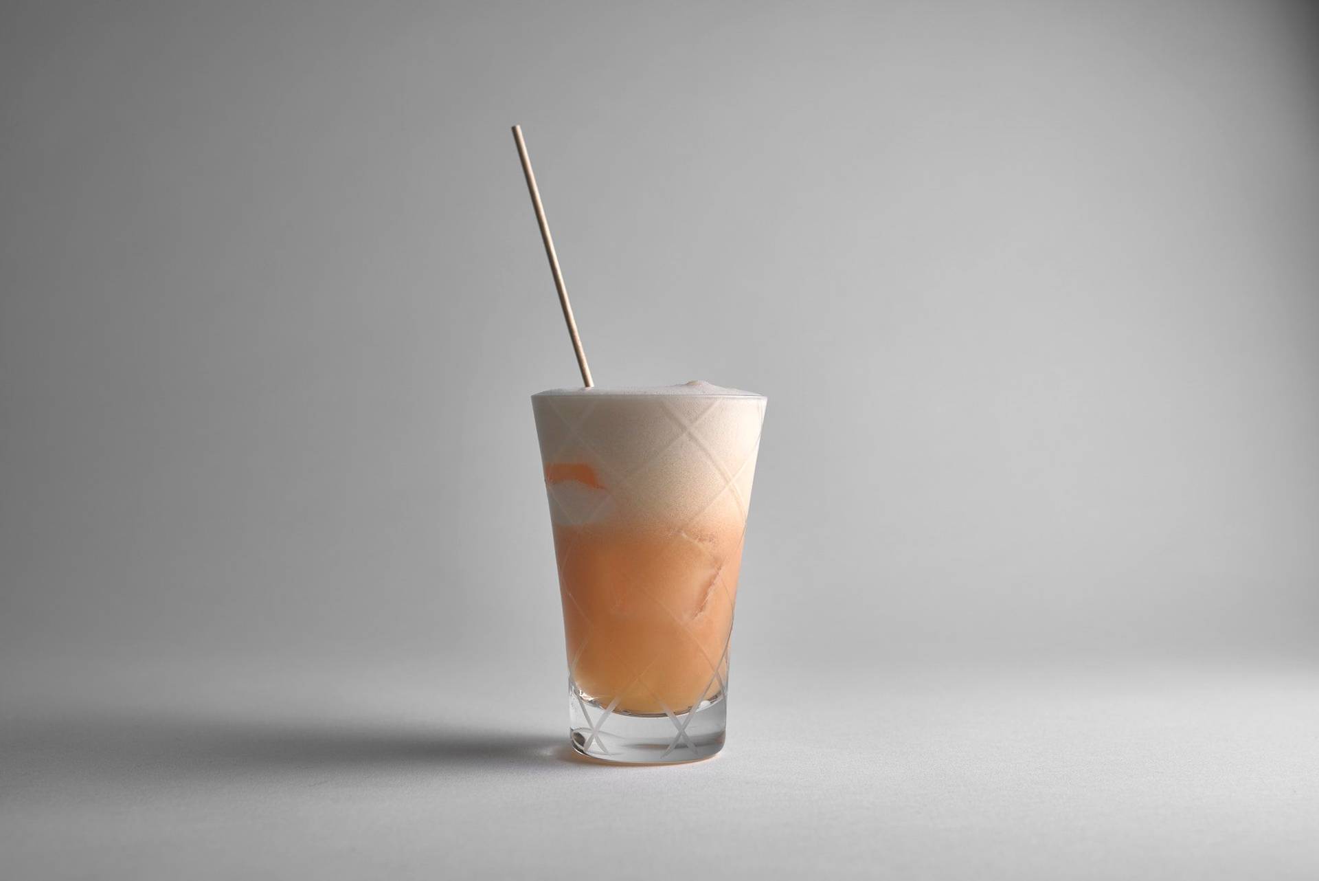 the kiss of sake cocktail on white background