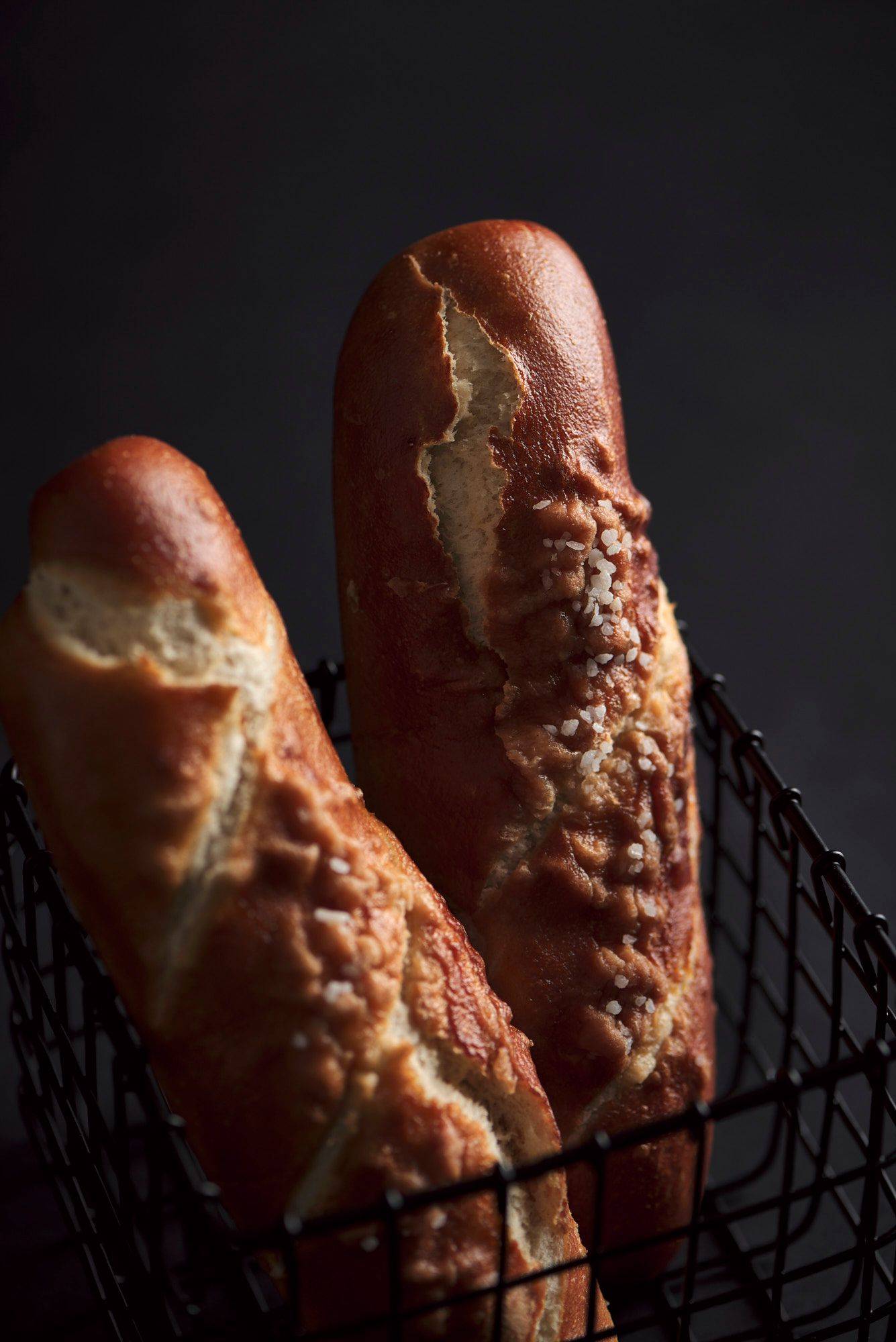 two pretzel sticks on a gray sapienstone top