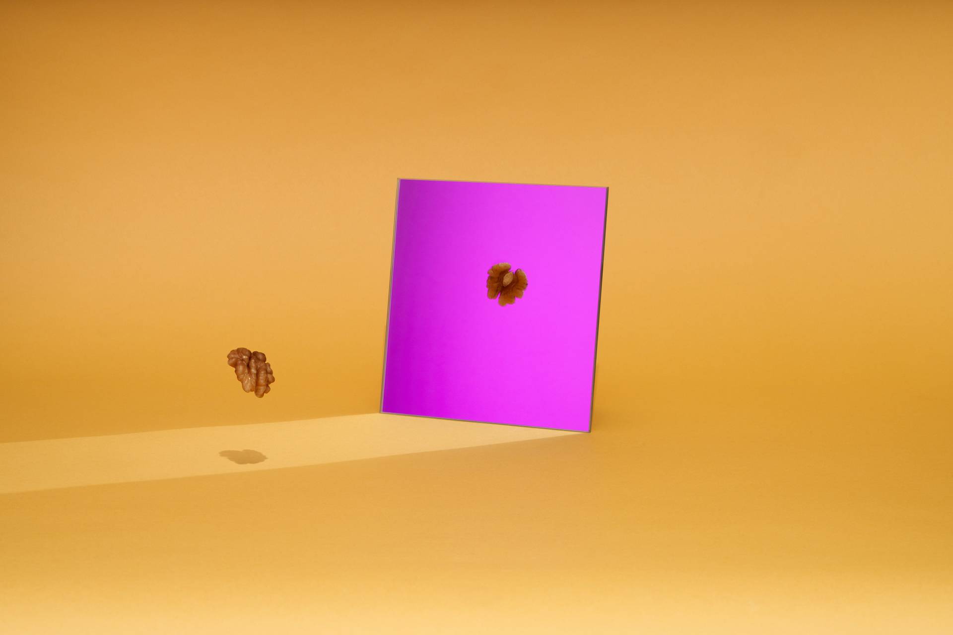 walnut with purple mirror on yellow background