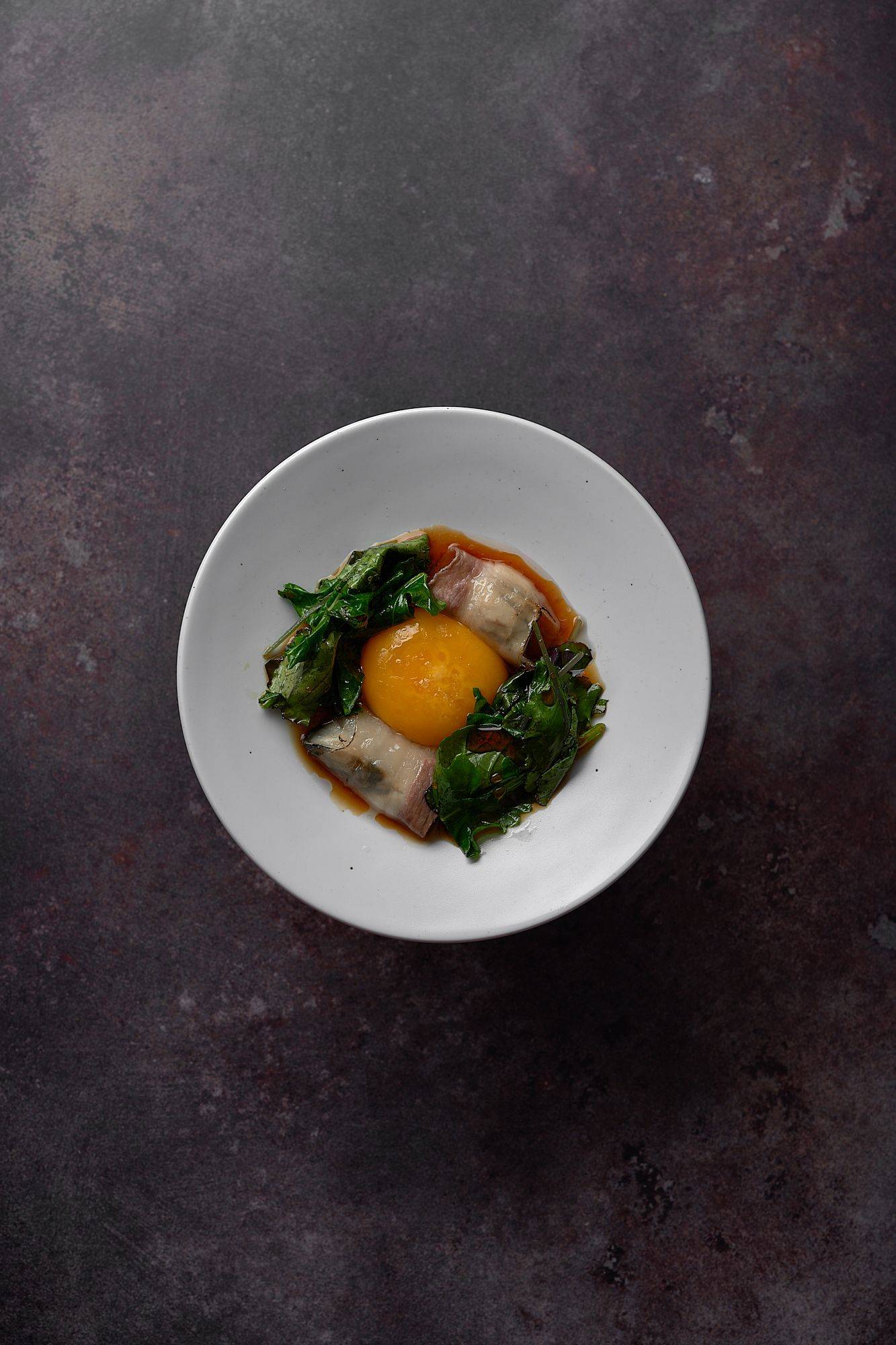 poached oyster lardo bacon egg yolk kale and ponzu at le duc salon