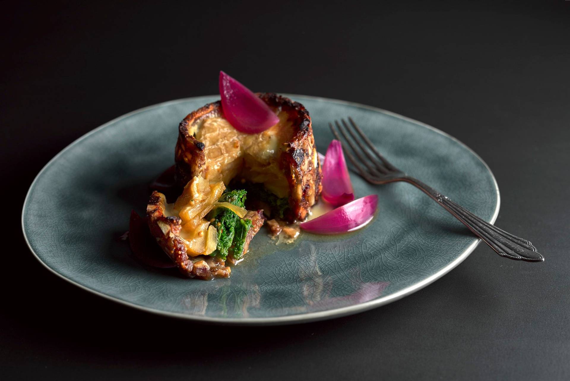 kale-cake-with-cheese-and-onion-pickles kale cake with cheese and onion pickles on black background