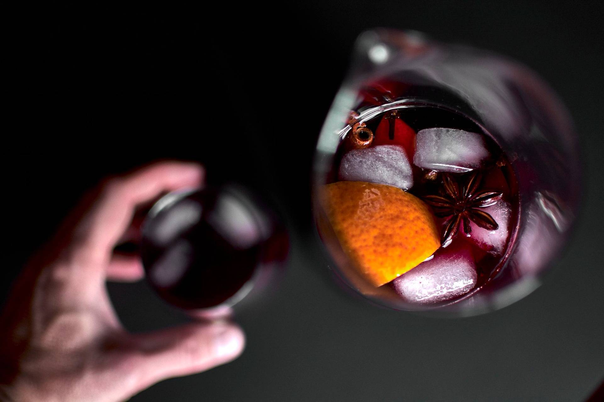 a jug of portuguese-ginja-sangria on black background