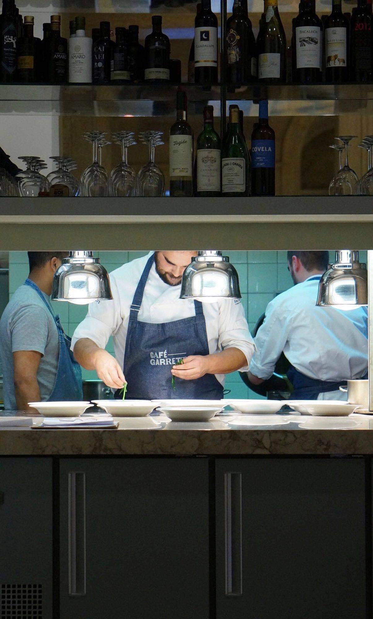 chef leopoldo calhau serving an olive oil dinner in lisbon