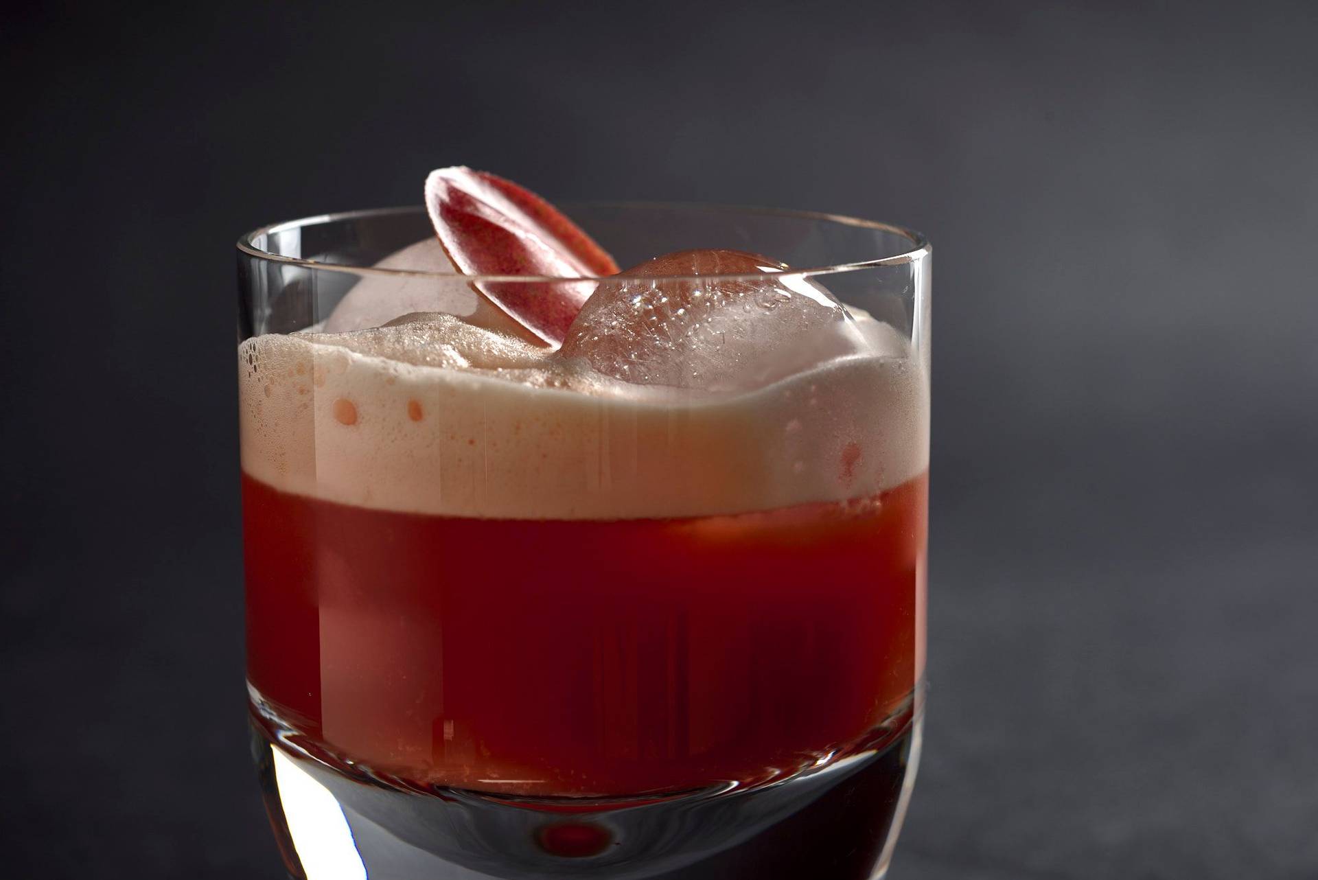 smoky-bell-pepper-whiskey-sour-cocktail smoky bell pepper whiskey sour cocktail on black background