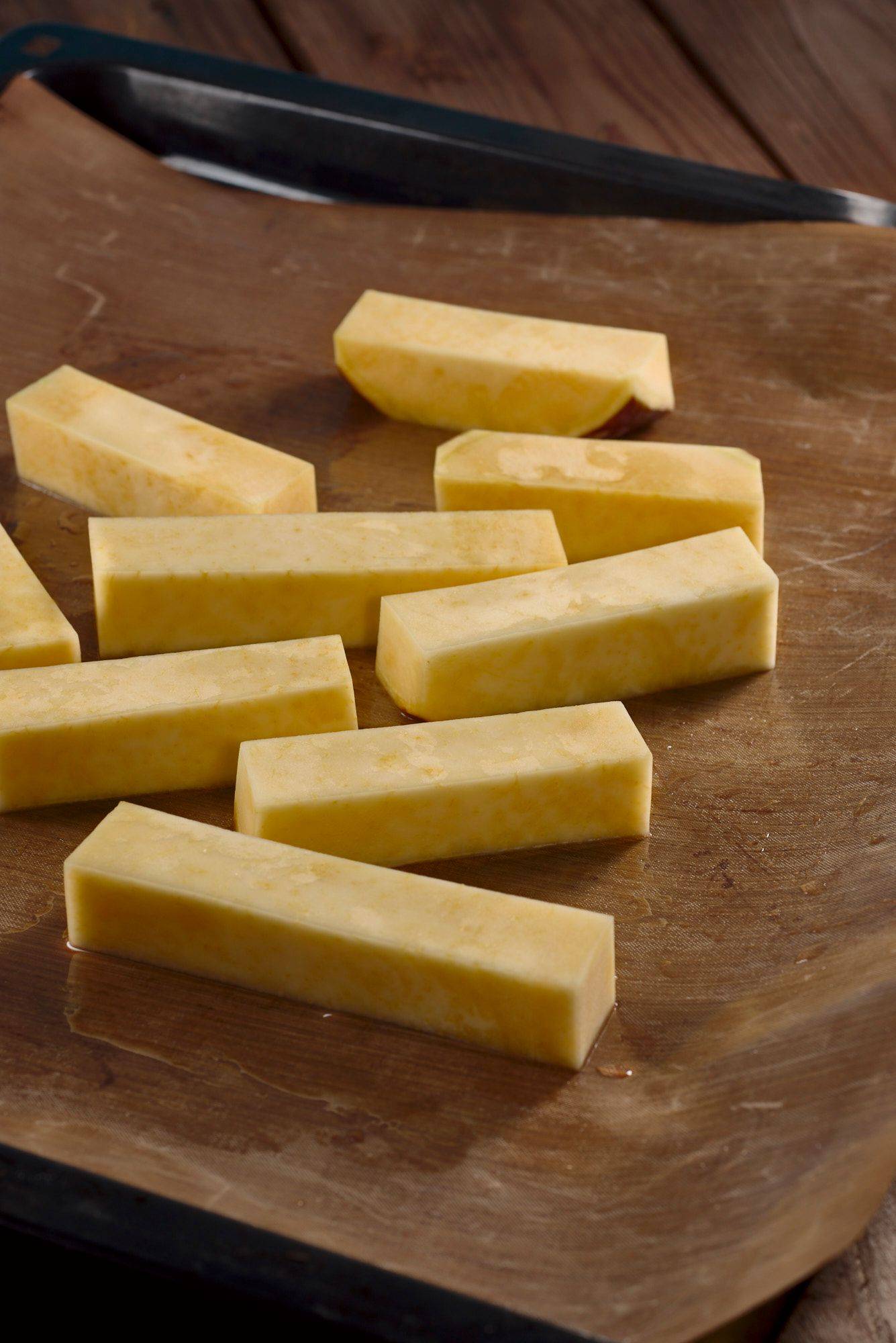 rutabaga-sticks rutabaga sticks on a baking sheet with wooden table