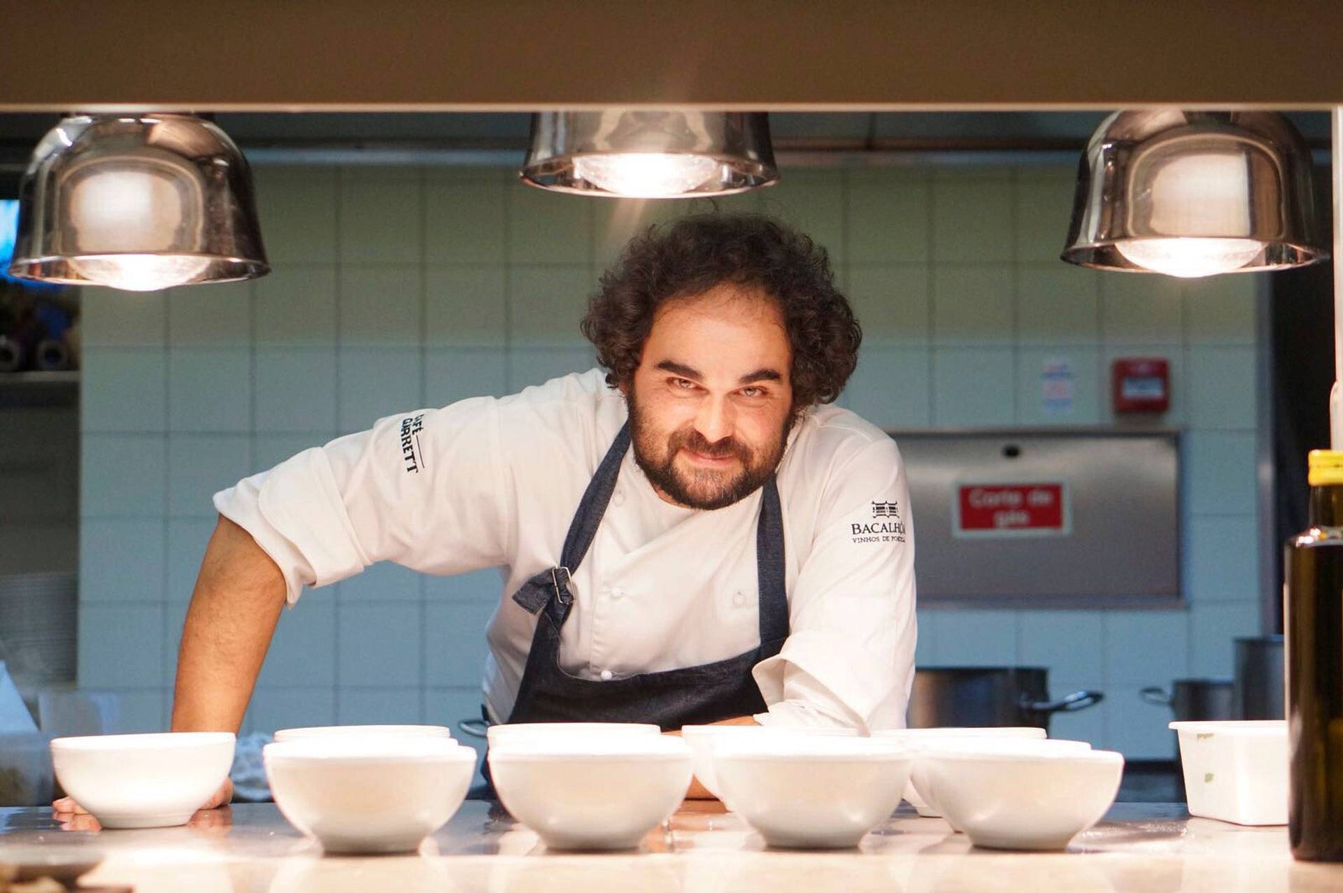 chef leopoldo calhau serving an olive oil dinner in lisbon