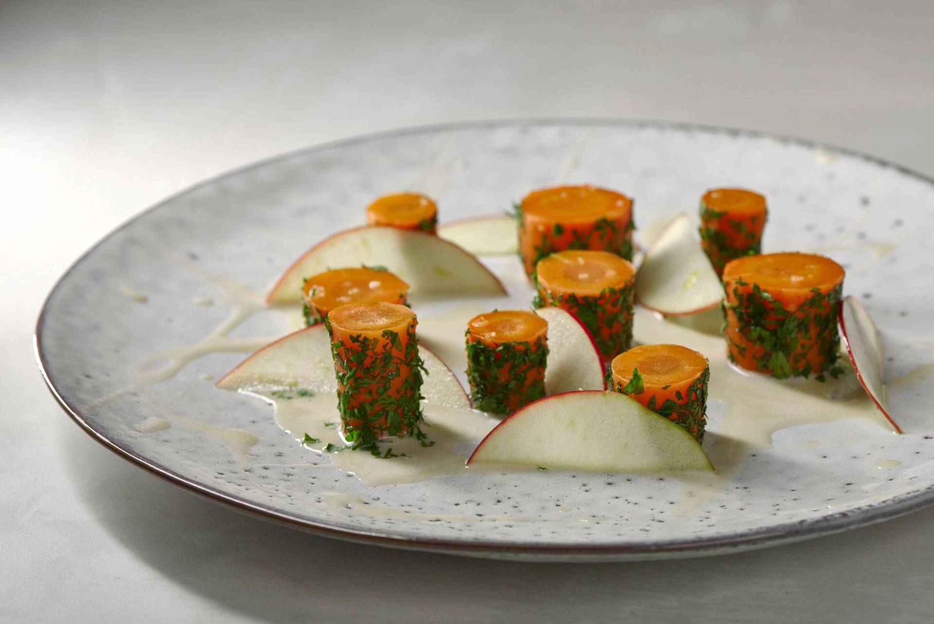 carrot and hay on a white plate with white sapienstone top 