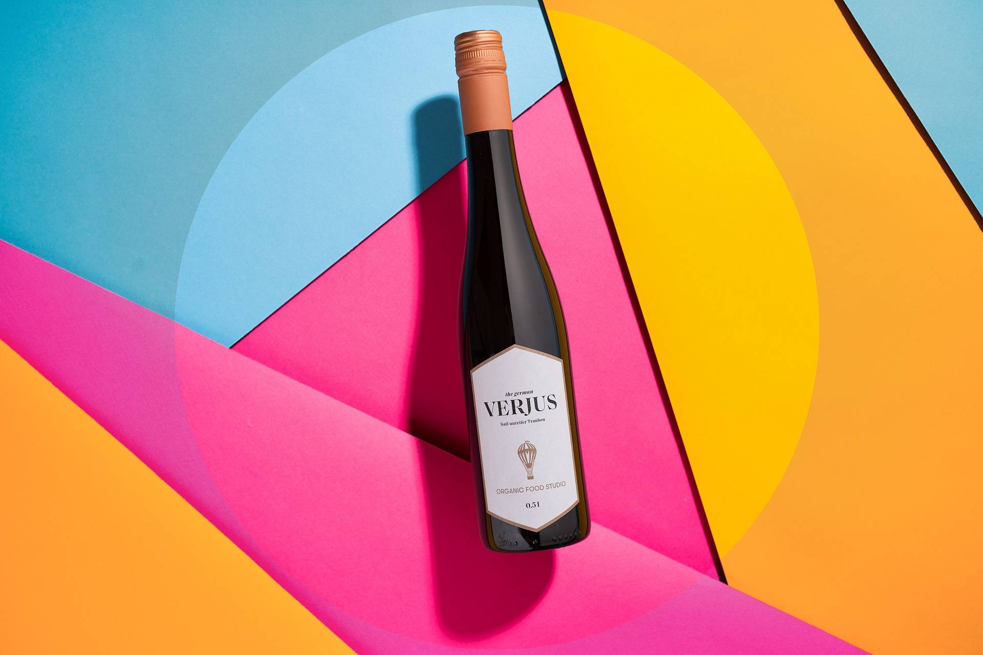 a bottle of verjus on colorful underground