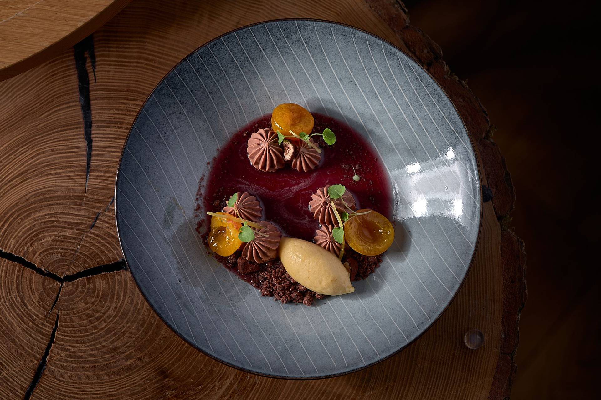 chocolate dessert with yellow plums by pastry chef nico klink