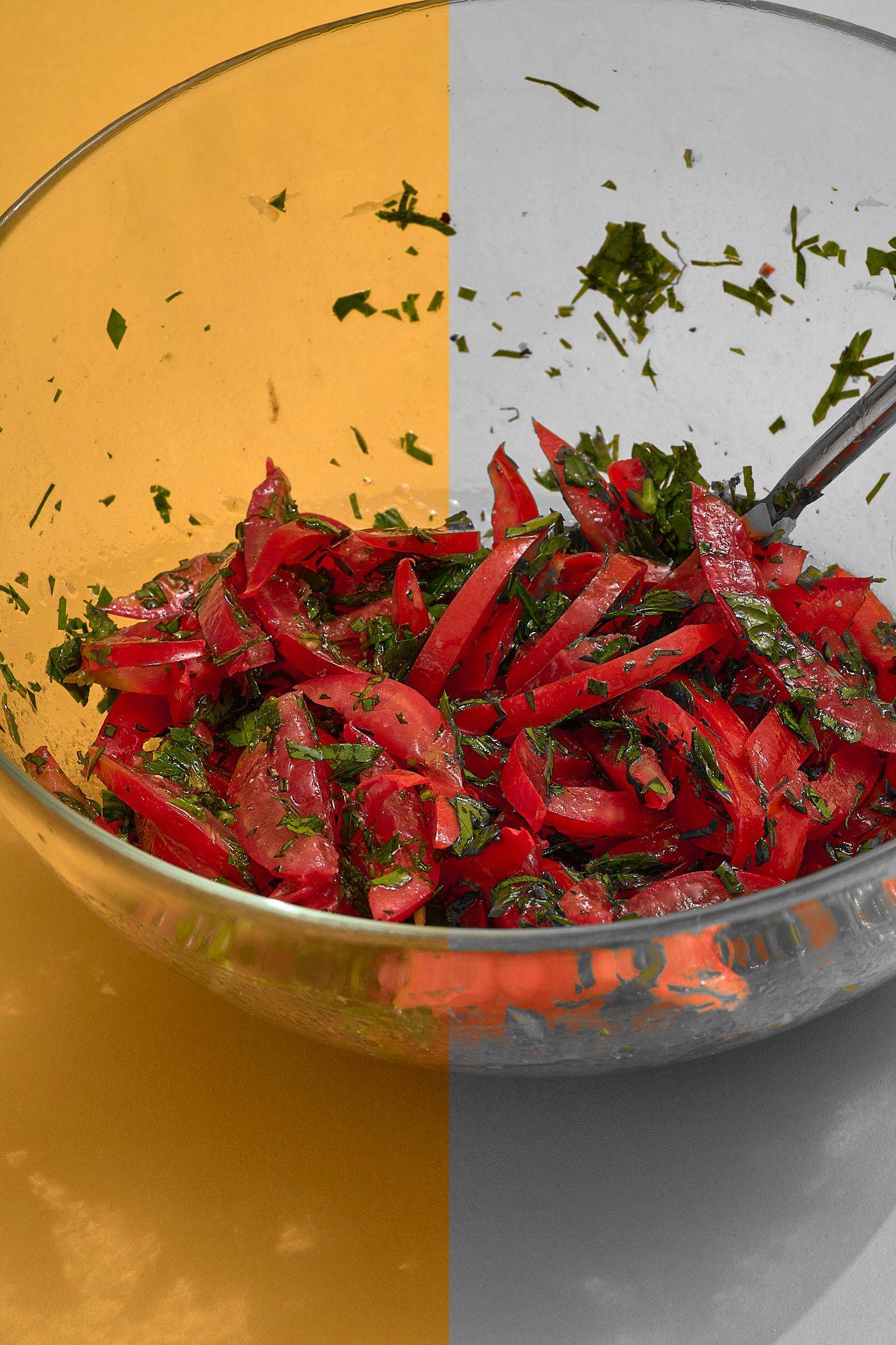 gremolata with mint parsley and tomatoes on yellow background